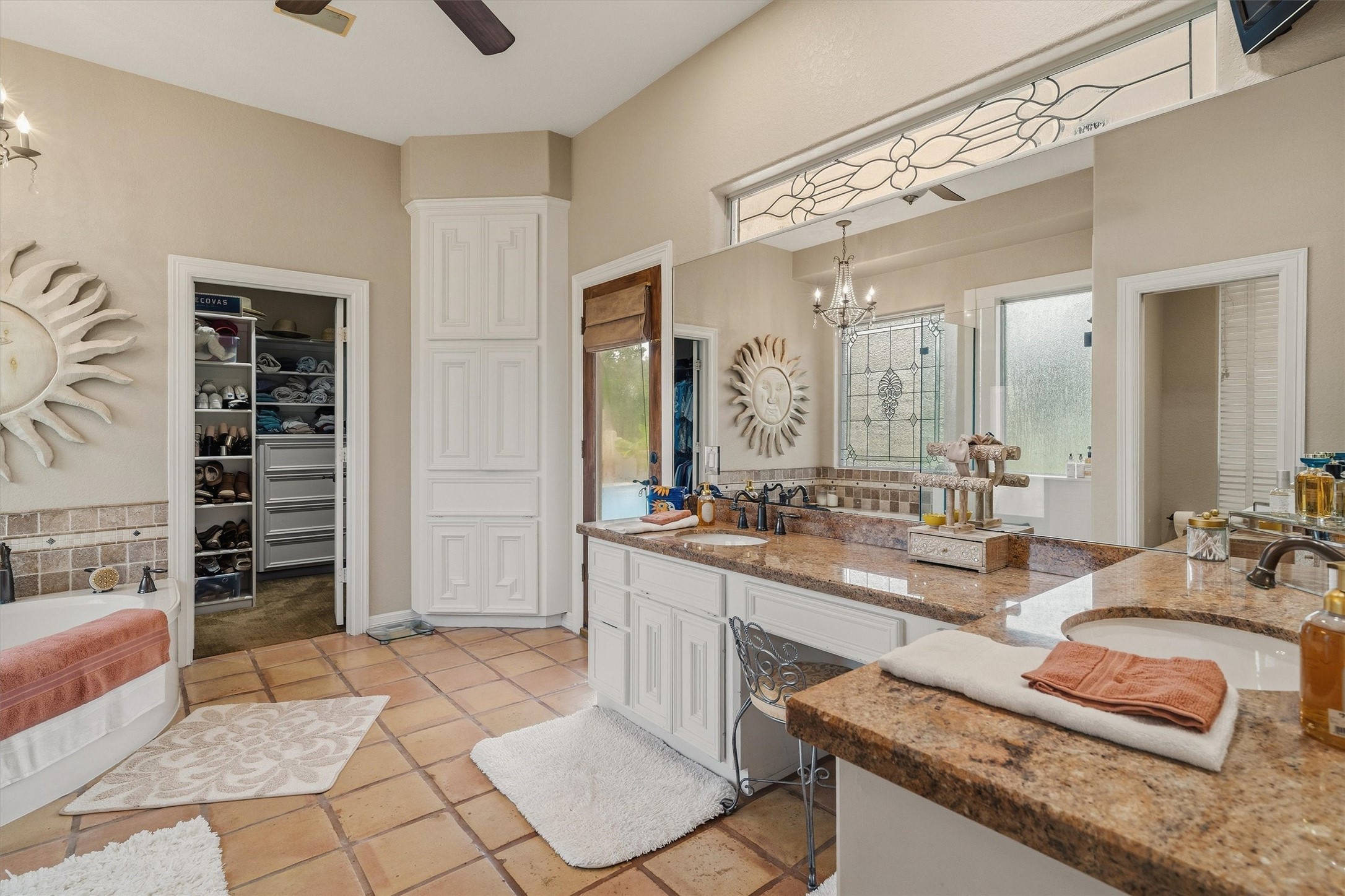 Primary en suite- double sinks, jacuzzi tub, and standalone seamless shower