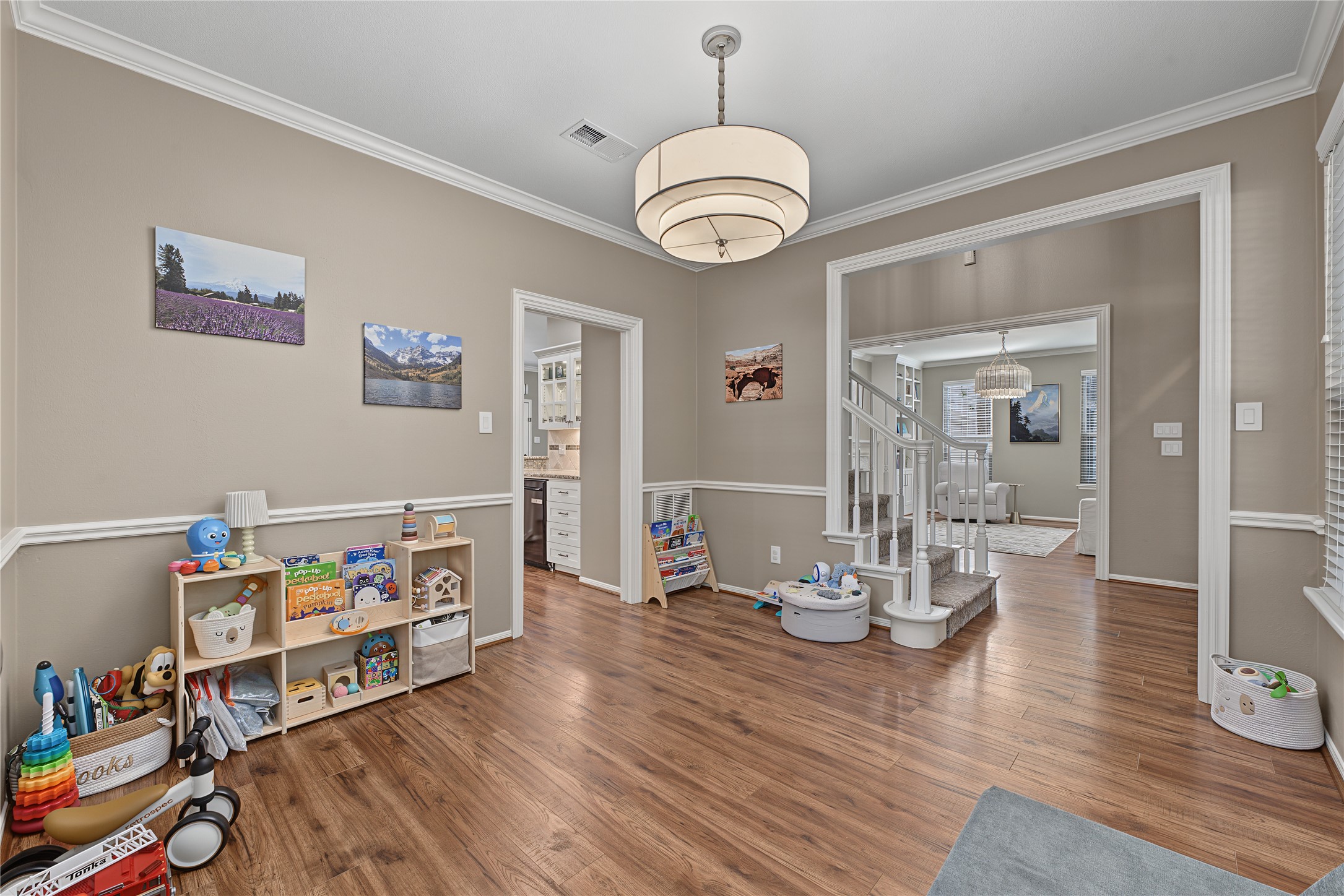 Like many other rooms in this home, the formal dining area offers updated lighting.