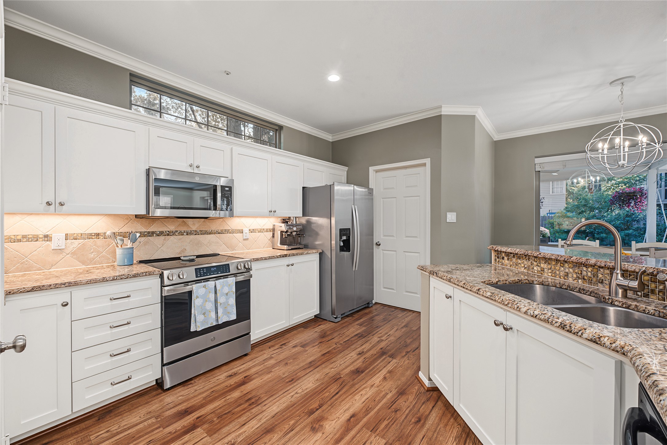 The door shown here opens to a laundry room offering convenient backyard access.