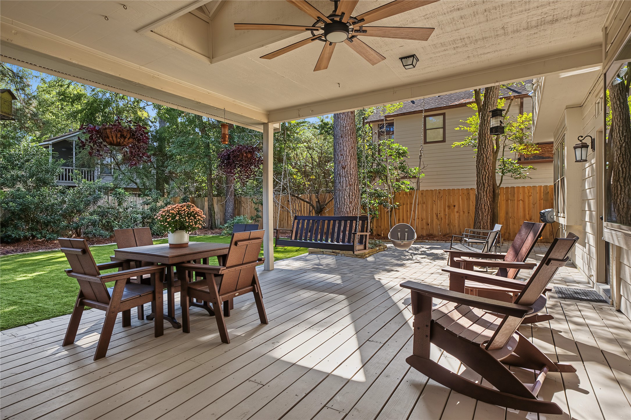 This beautiful covered porch provides a comfortable and inviting outdoor living space perfect for relaxing or entertaining.