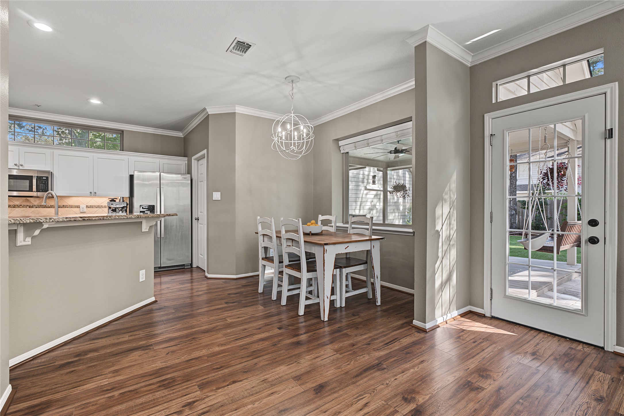 Open-concept kitchen fills with natural light during the day and offers modern lighting for night.