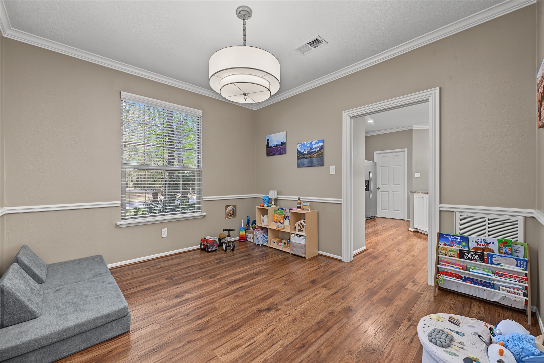 Formal dining room off of the kitchen also functions perfectly as a playroom.