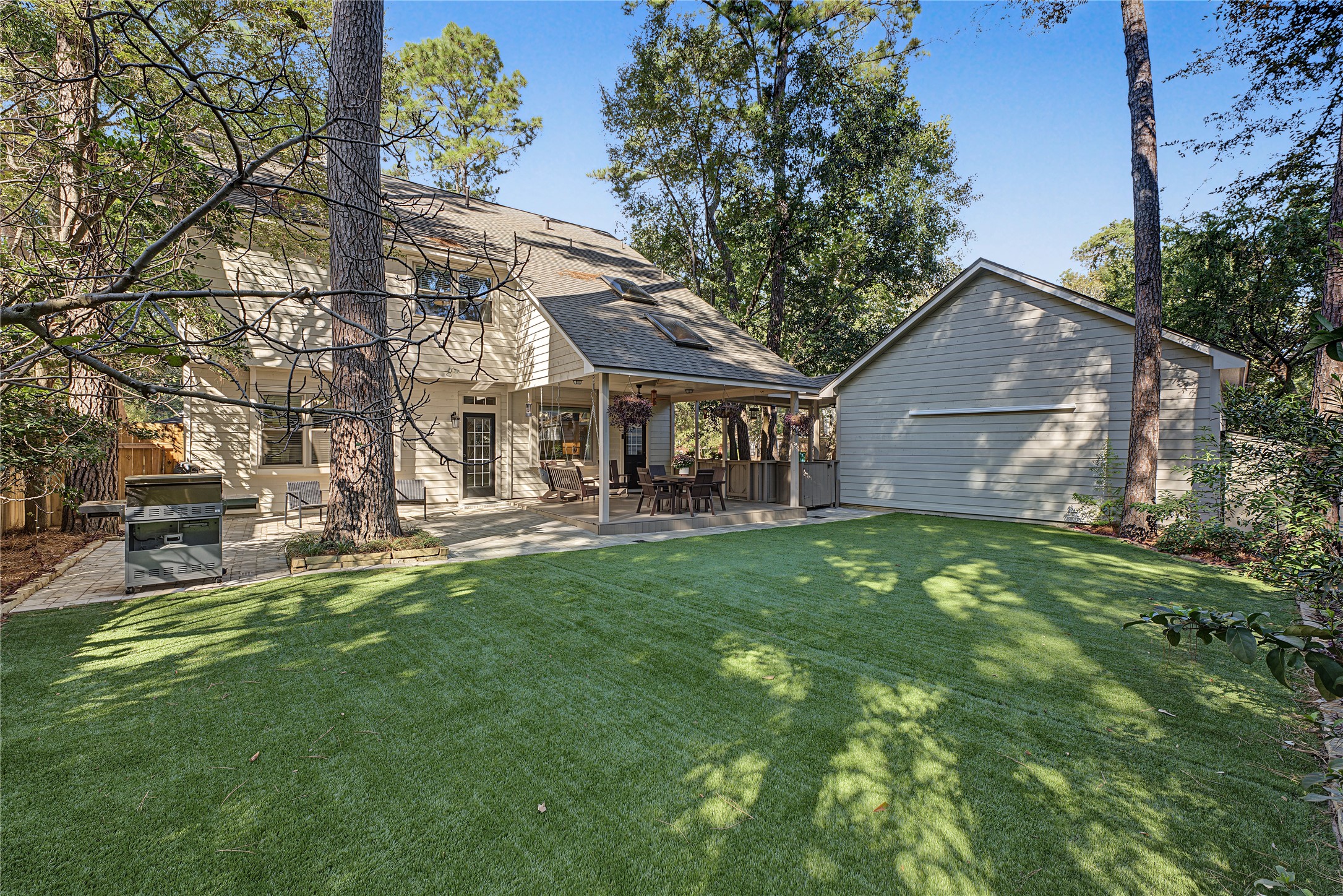 The detached garage offers a covered walkway to the home, perfect for inclement weather days.