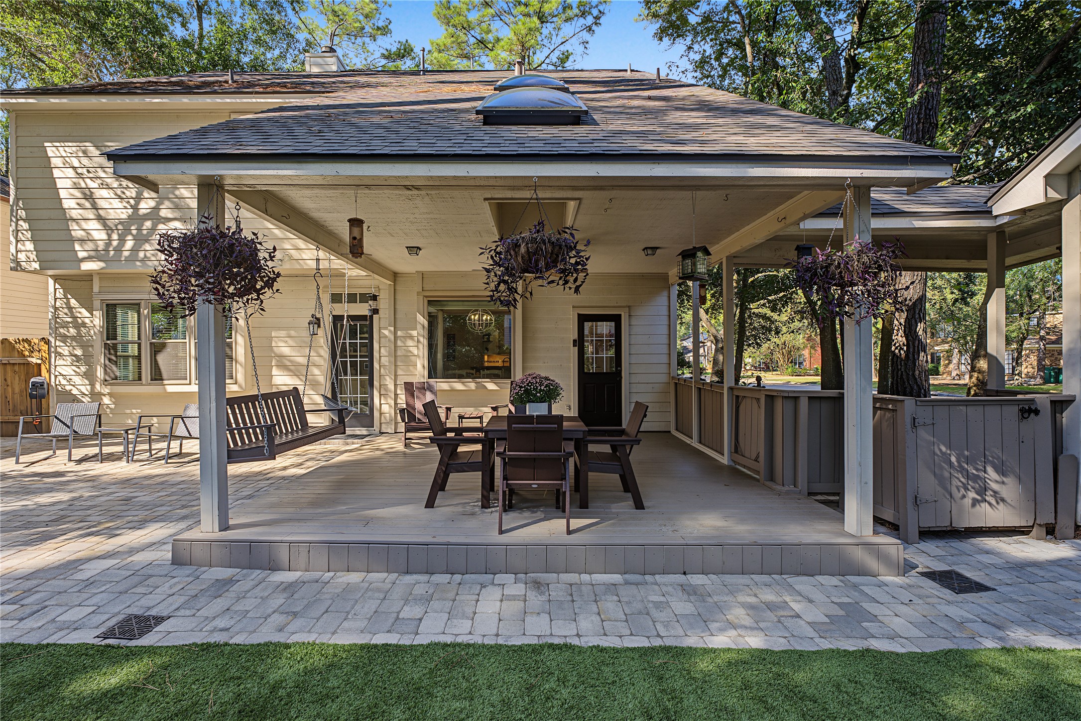 The newly updated pavers and artificial turf create a gorgeous backyard that requires no mowing!
