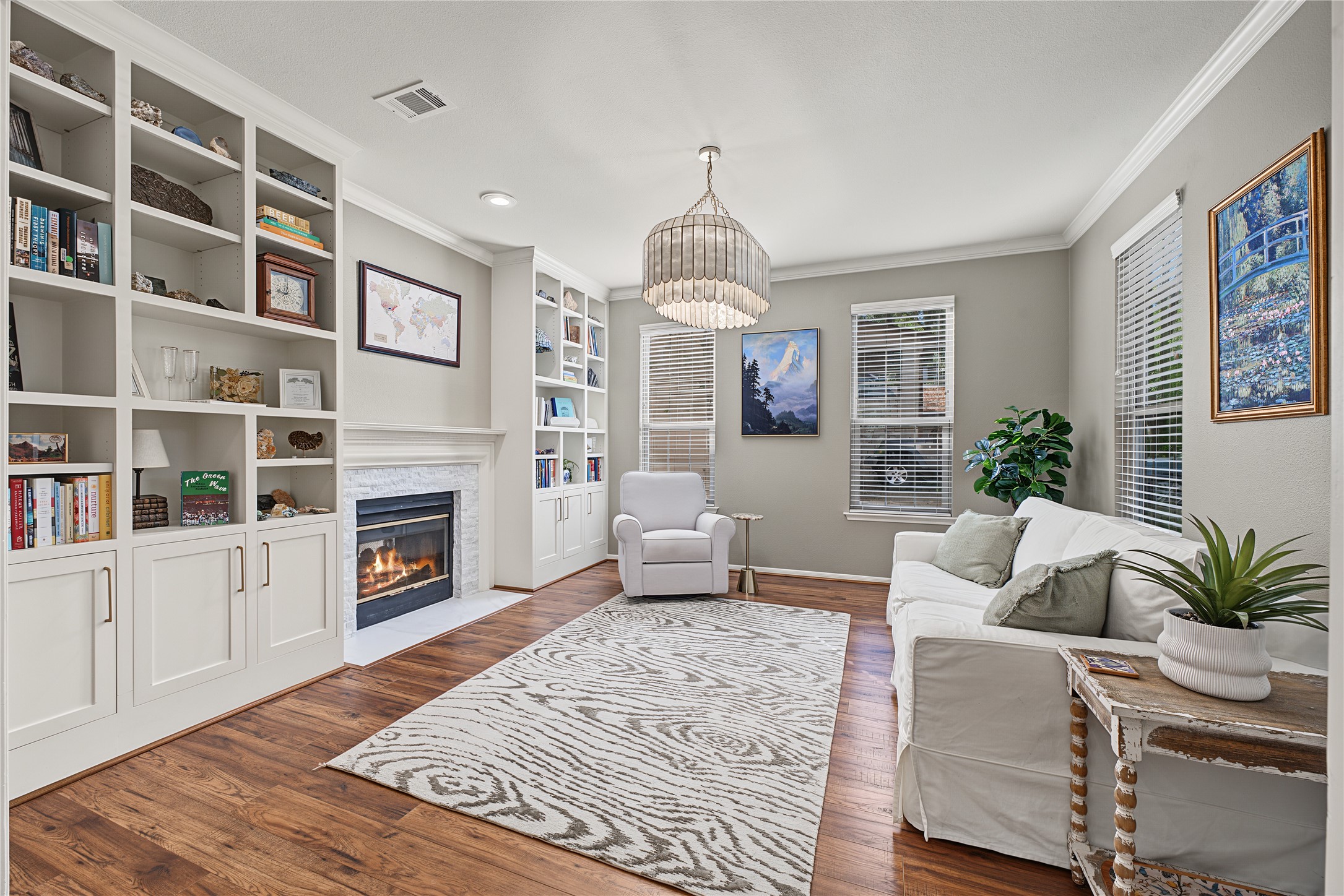 Updated flooring, lighting, and custom stacked stone fireplace surround.