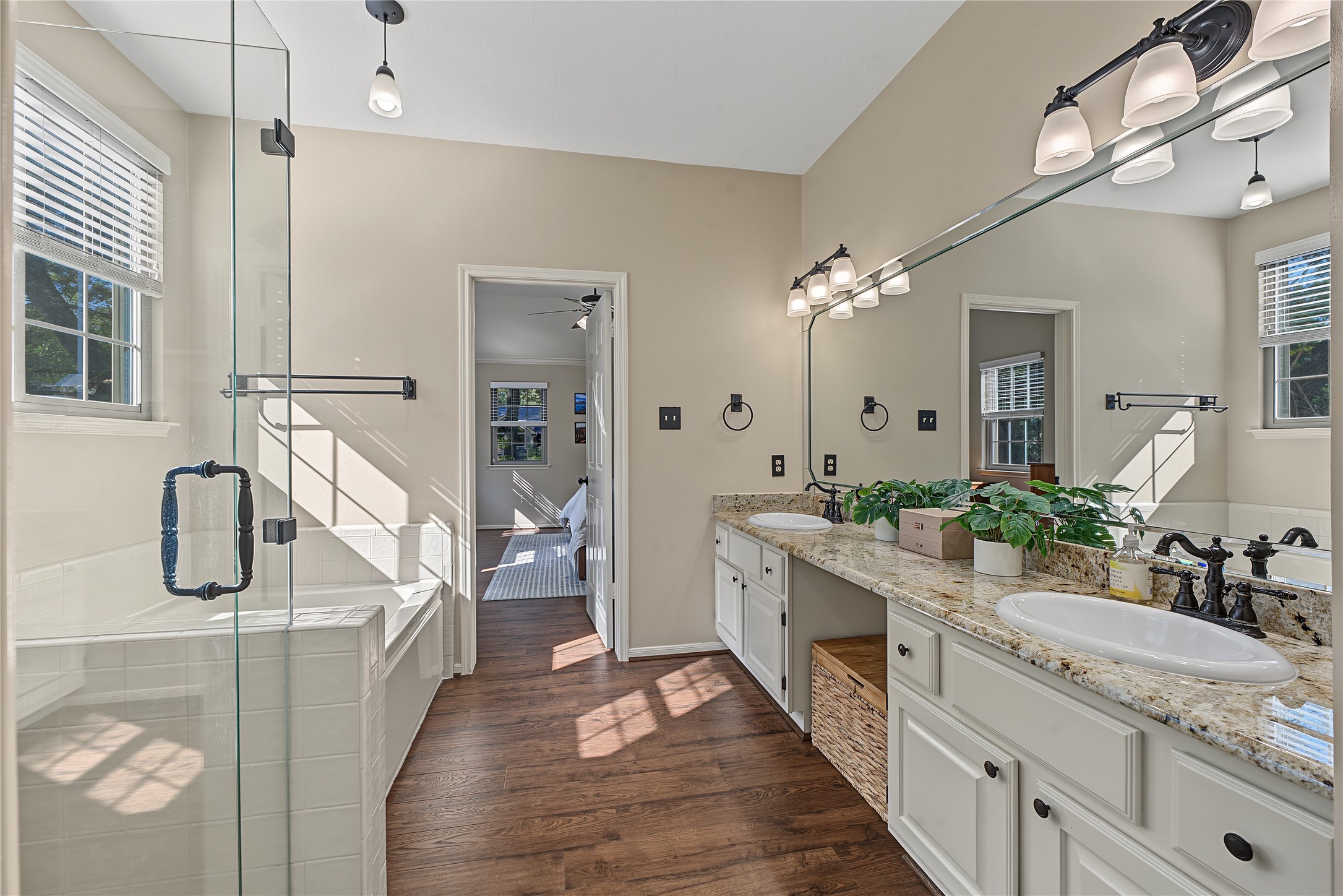 Double vanity featuring updated hardware and light fixtures.