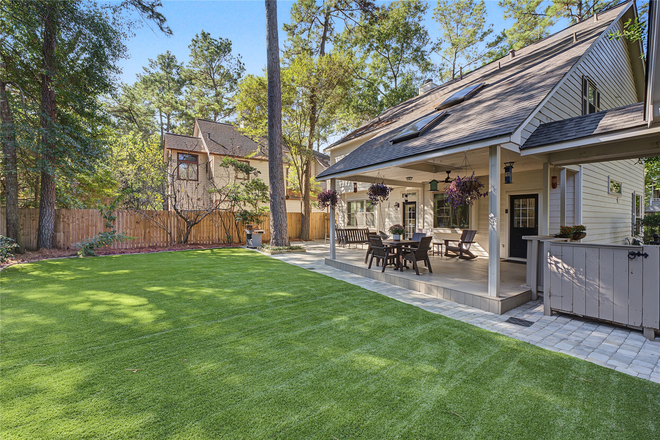 Stunning backyard oasis featuring low-maintenance artificial turf for effortless outdoor living.