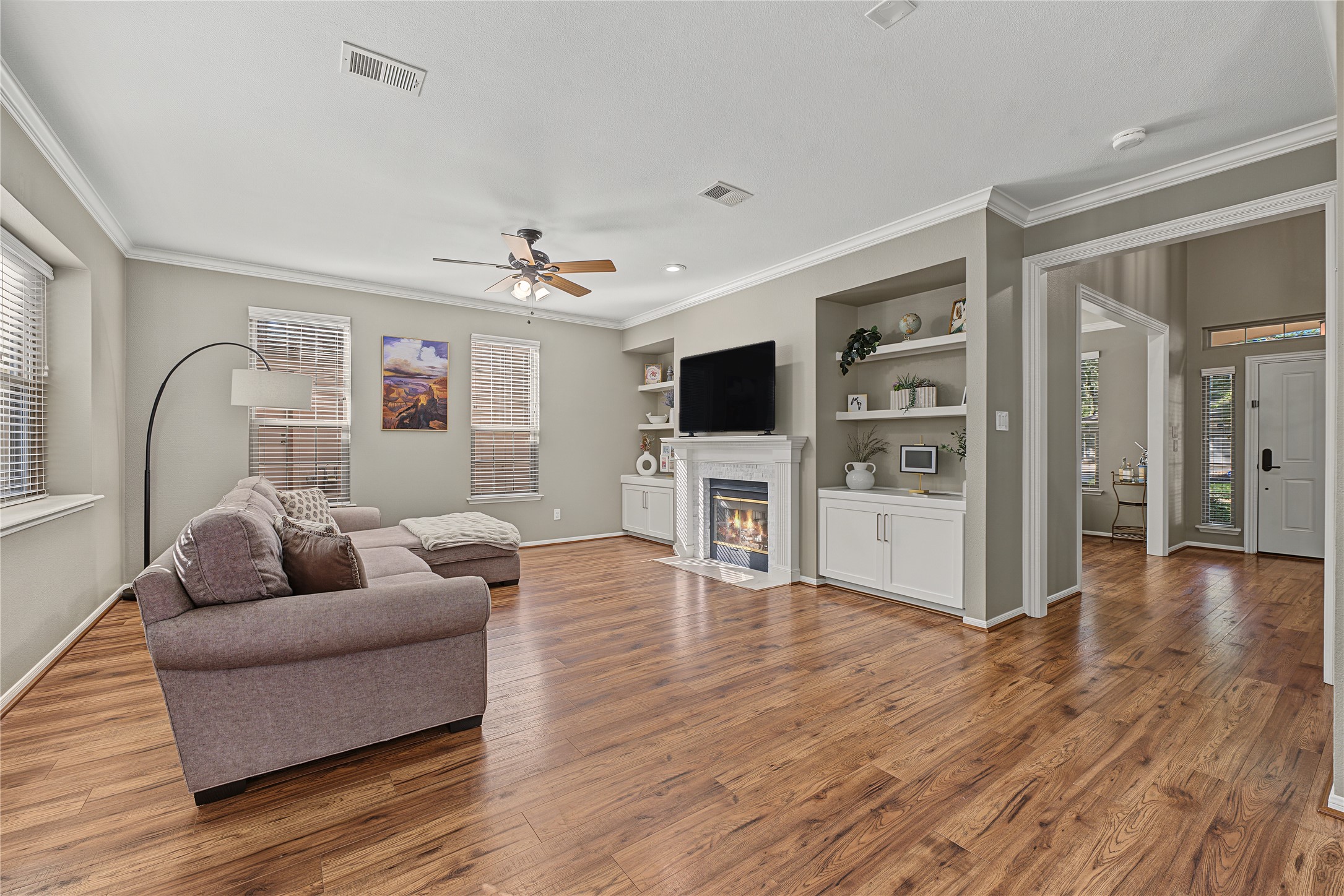 Spacious, open-concept living room that seamlessly flows into the kitchen area.