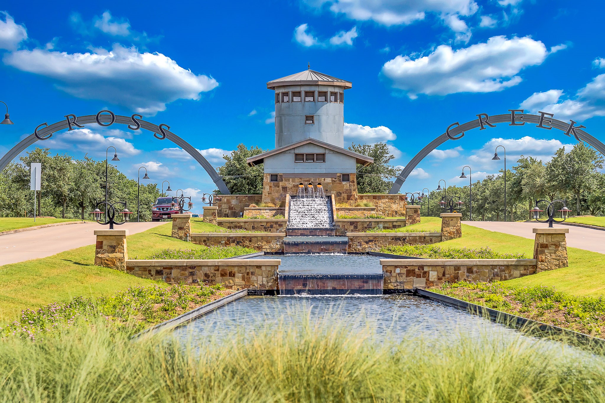 Pass through the striking entry arches into Cross Creek Ranch  a vibrant, nature-connected community offering lakes, trails, parks, and resort-style amenities in the heart of Fulshear.