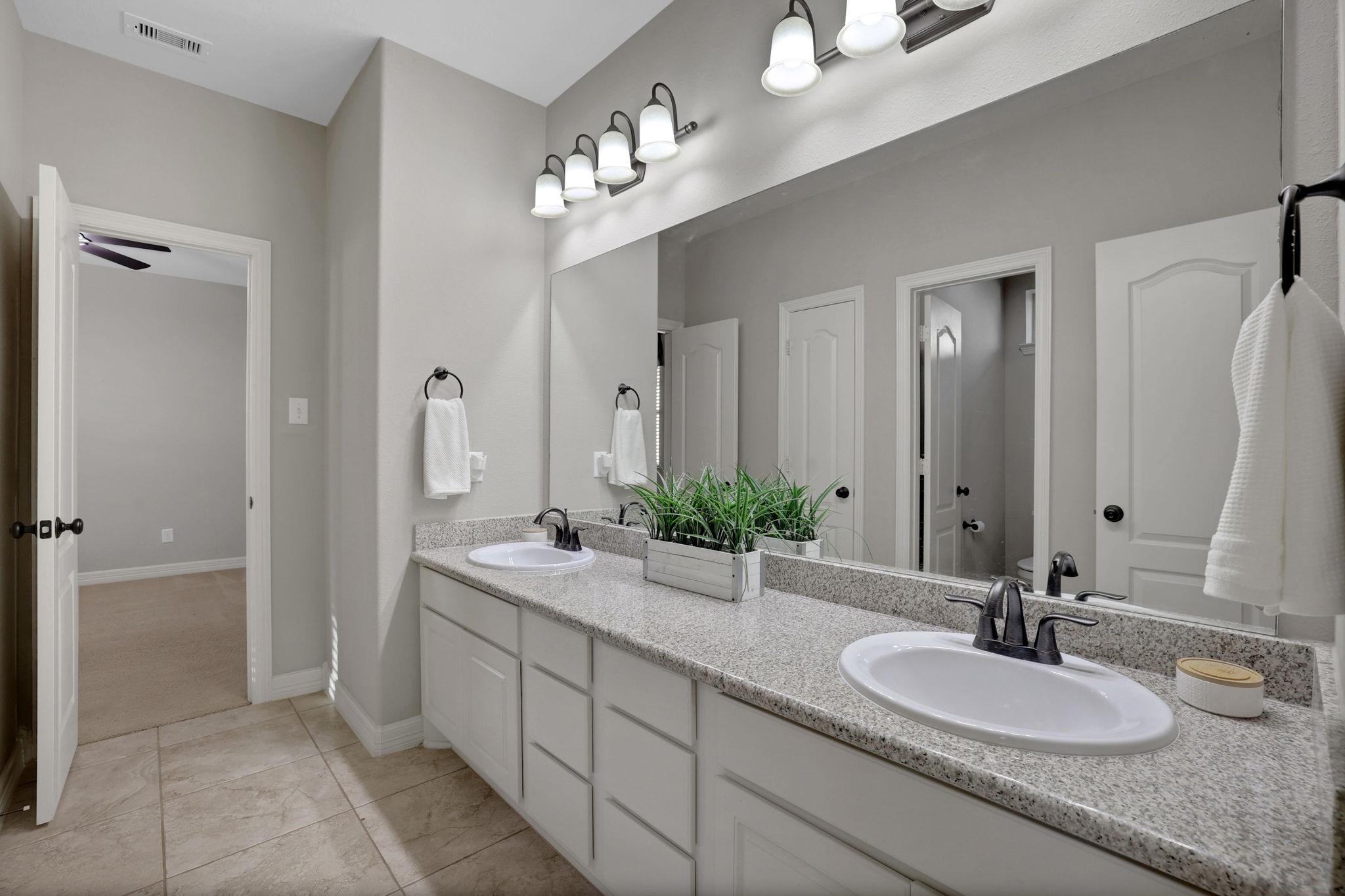 Jack n jill bathroom upstairs with two bedrooms flanking it