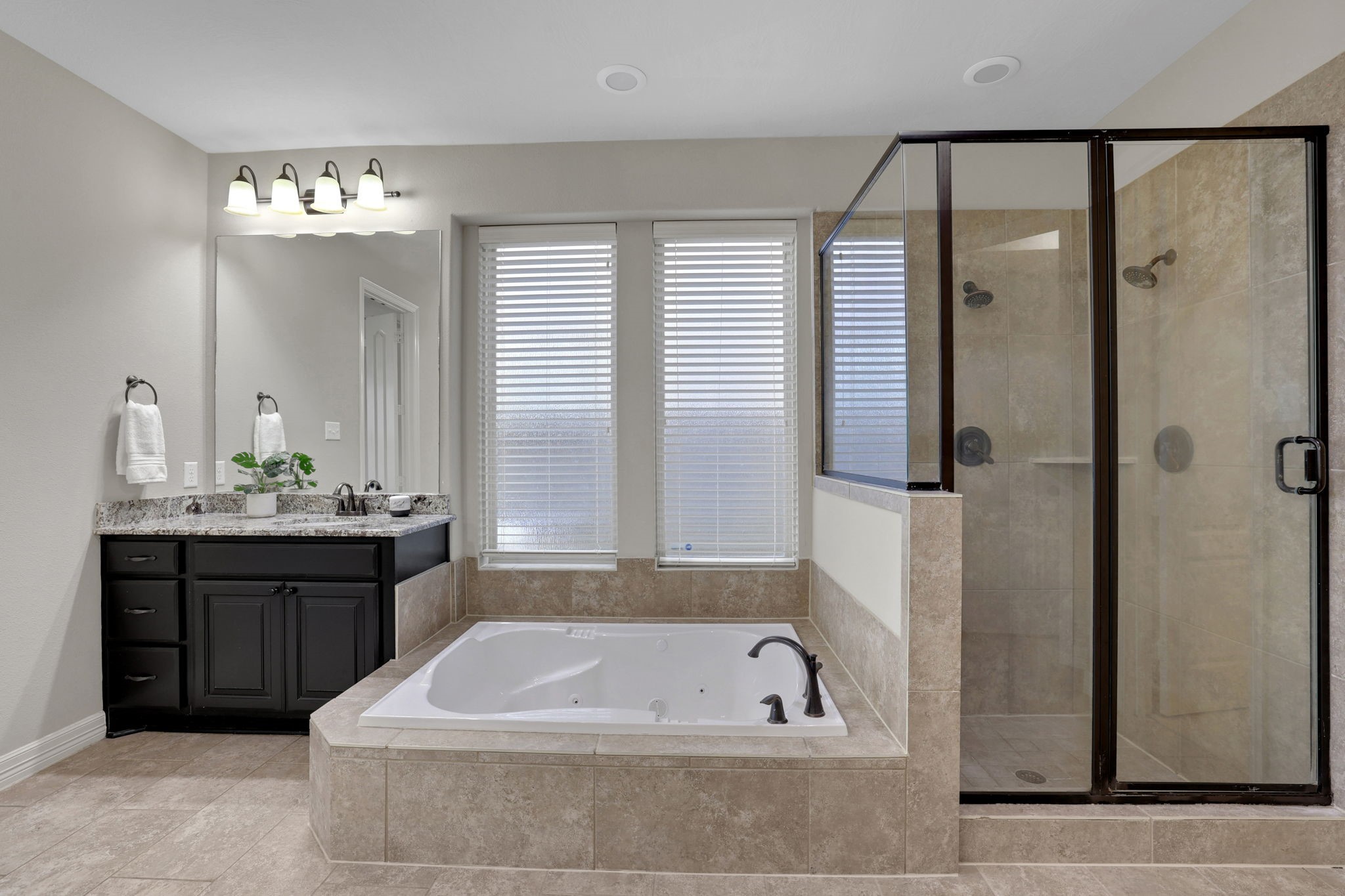 Another view of the oversized shower and soaking tub in the primary bathroom