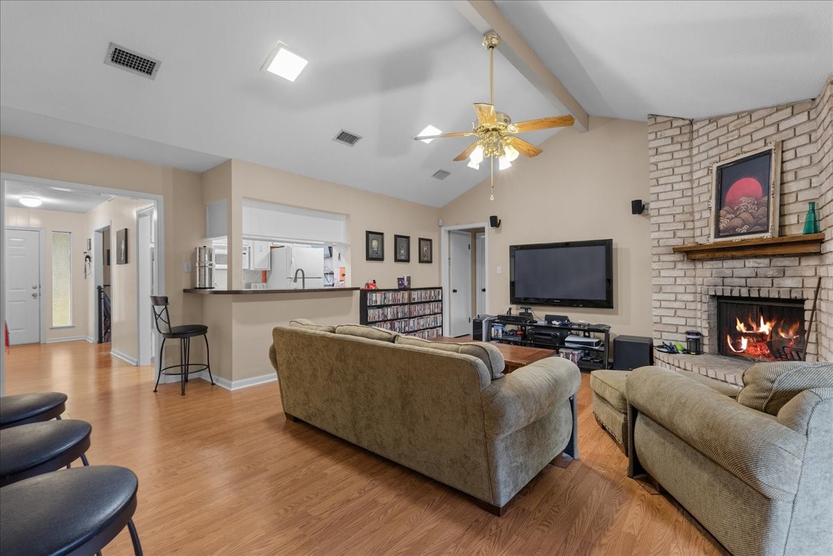 Open living area with vaulted ceiling and convenient kitchen pass-through. Open living area with vaulted ceiling and convenient kitchen pass-through.