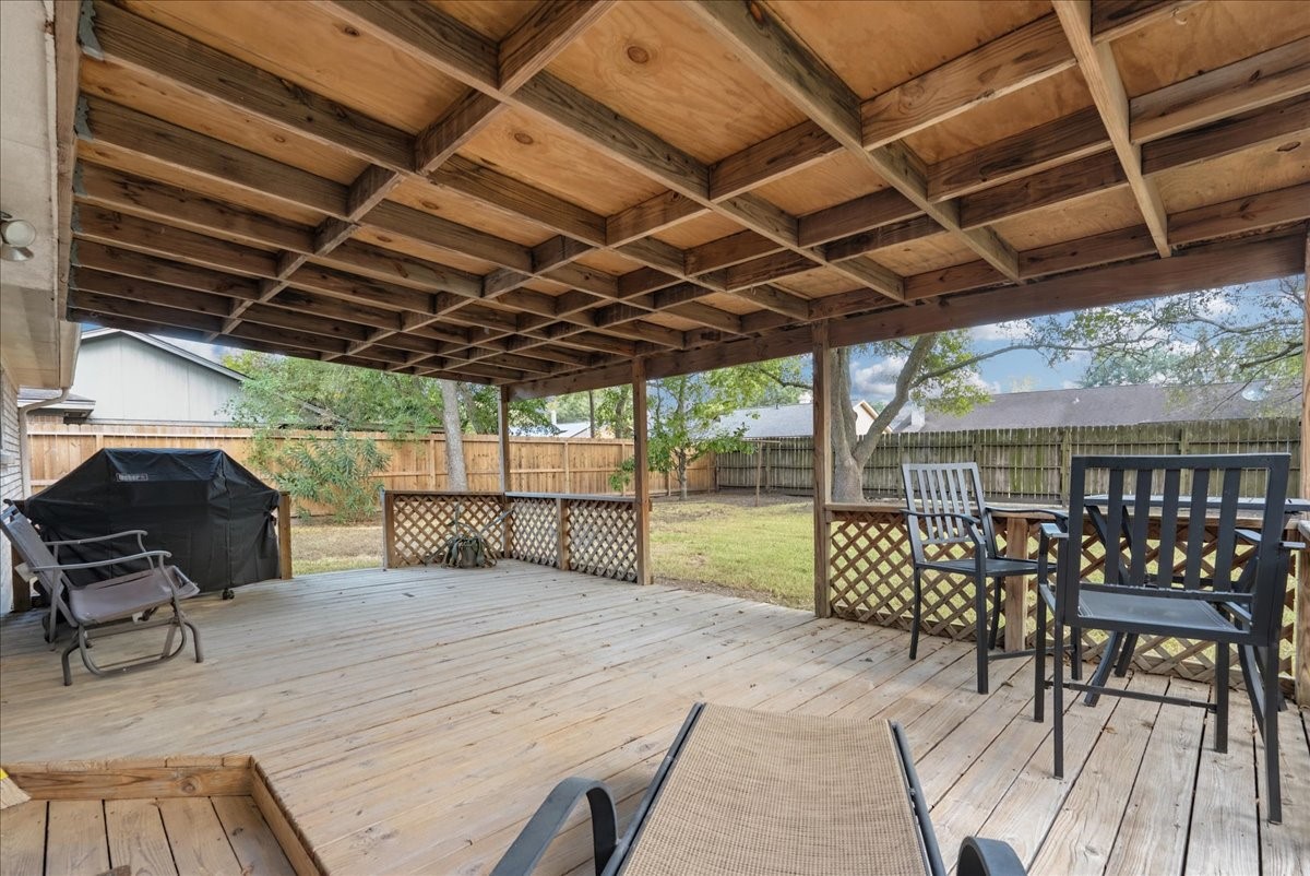 Spacious covered deck offers an inviting setting for outdoor dining, entertaining, or relaxing. Spacious covered deck offers an inviting setting for outdoor dining, entertaining, or relaxing.