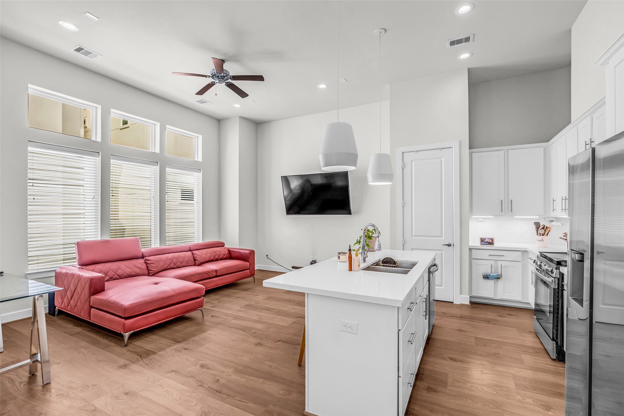 Full view from the dining area showcasing the kitchen and living room, highlighting the connected layout and flow between these main living areas.