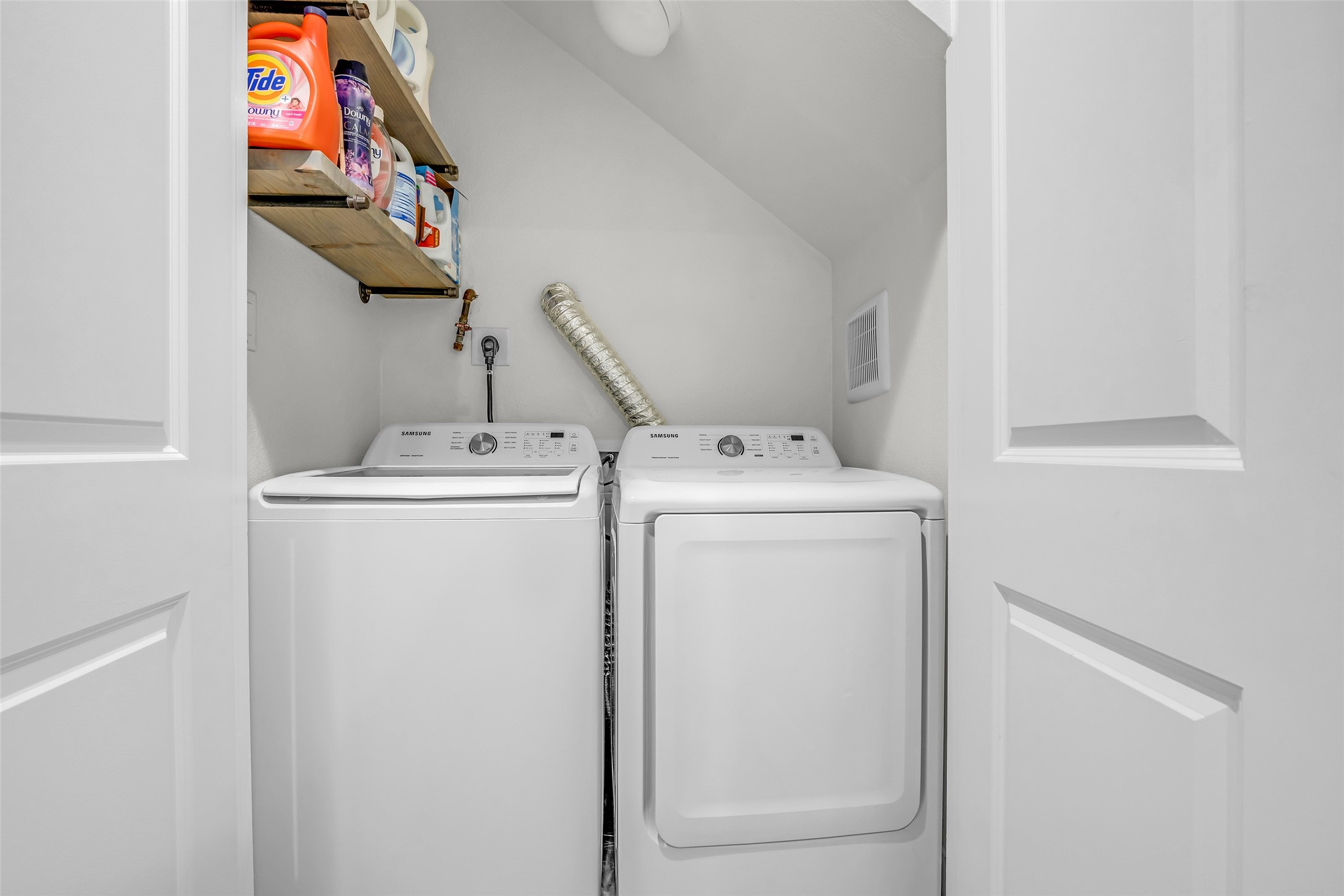 Laundry room with washer and electric/gas dryer connections, providing a dedicated space for your laundry needs and added household convenience.