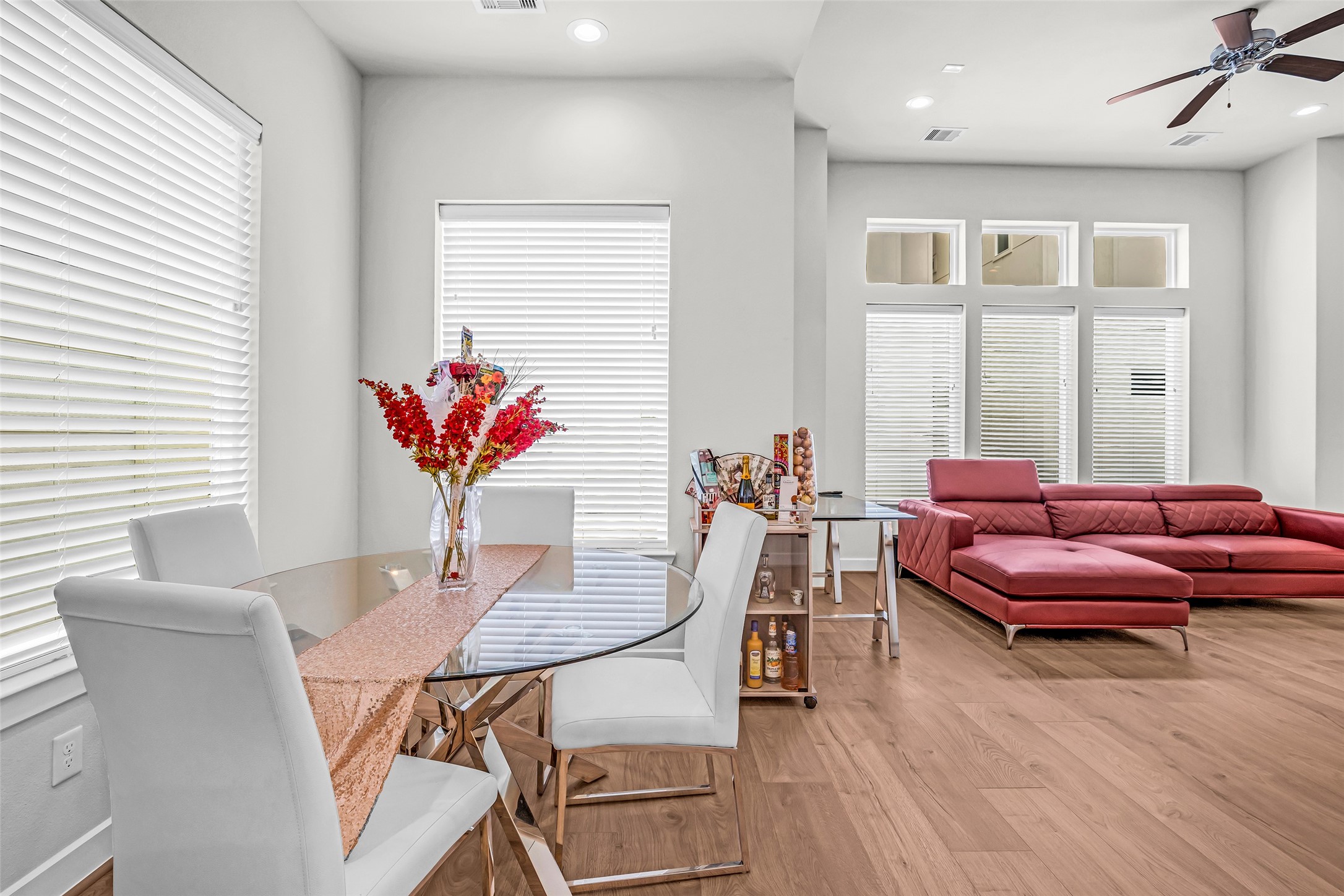 From the dining area, this view extends into the living room, highlighting the open layout and smooth flow between the shared living spaces.