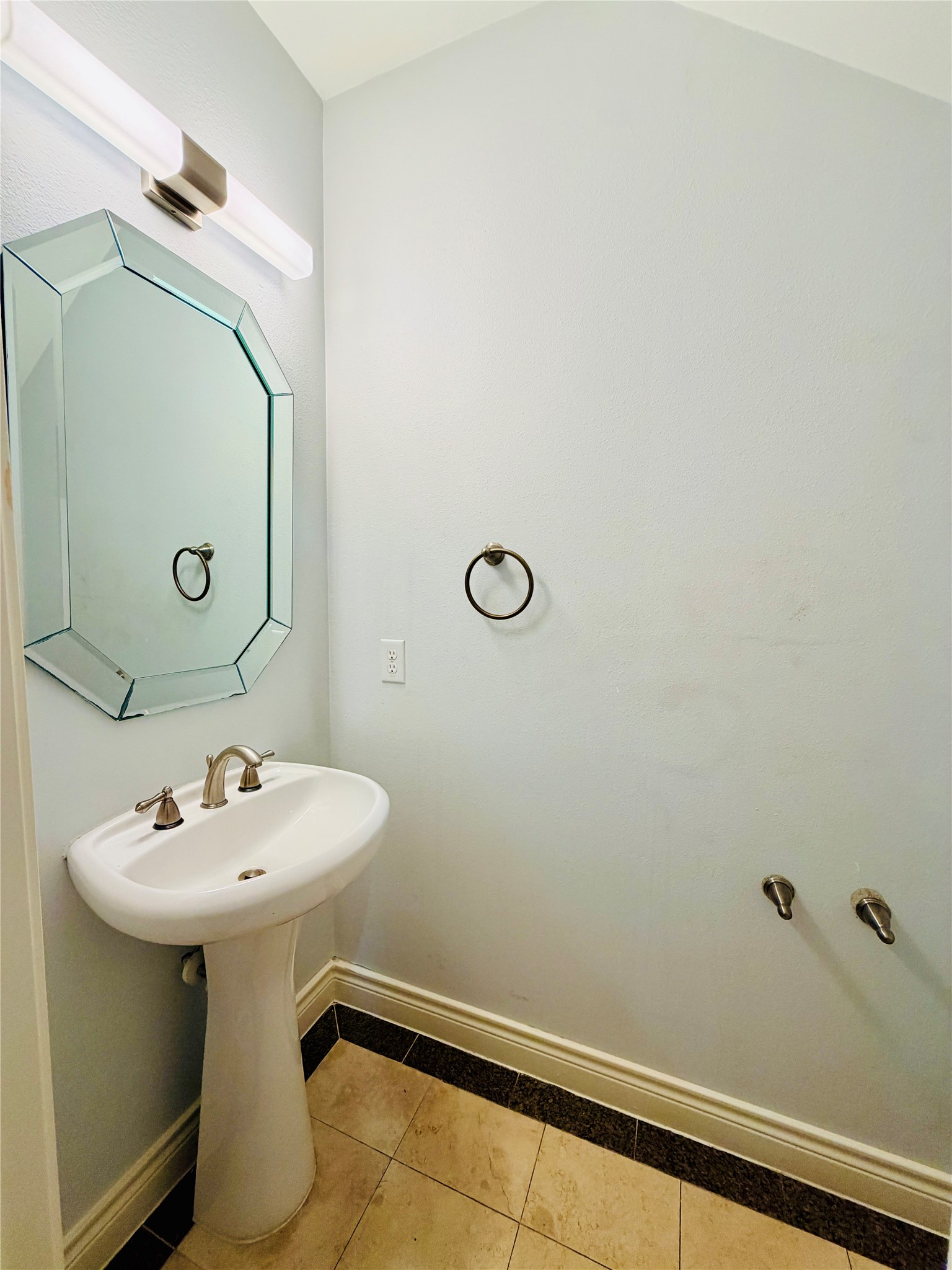 A powder room located on the first floor, convenient for guests and vistors.