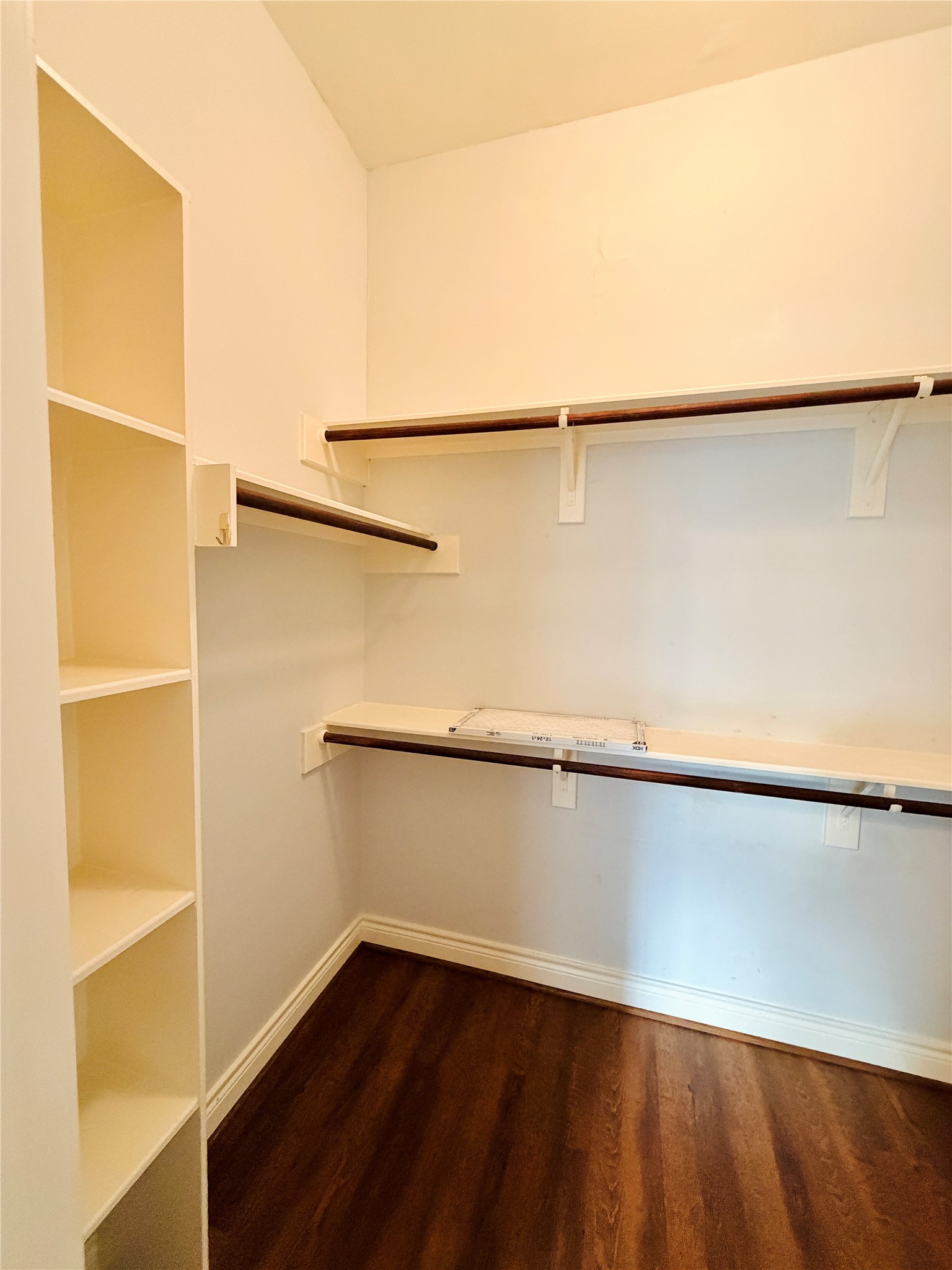 Another view of one of the large walk-in closets in the primary suite.
