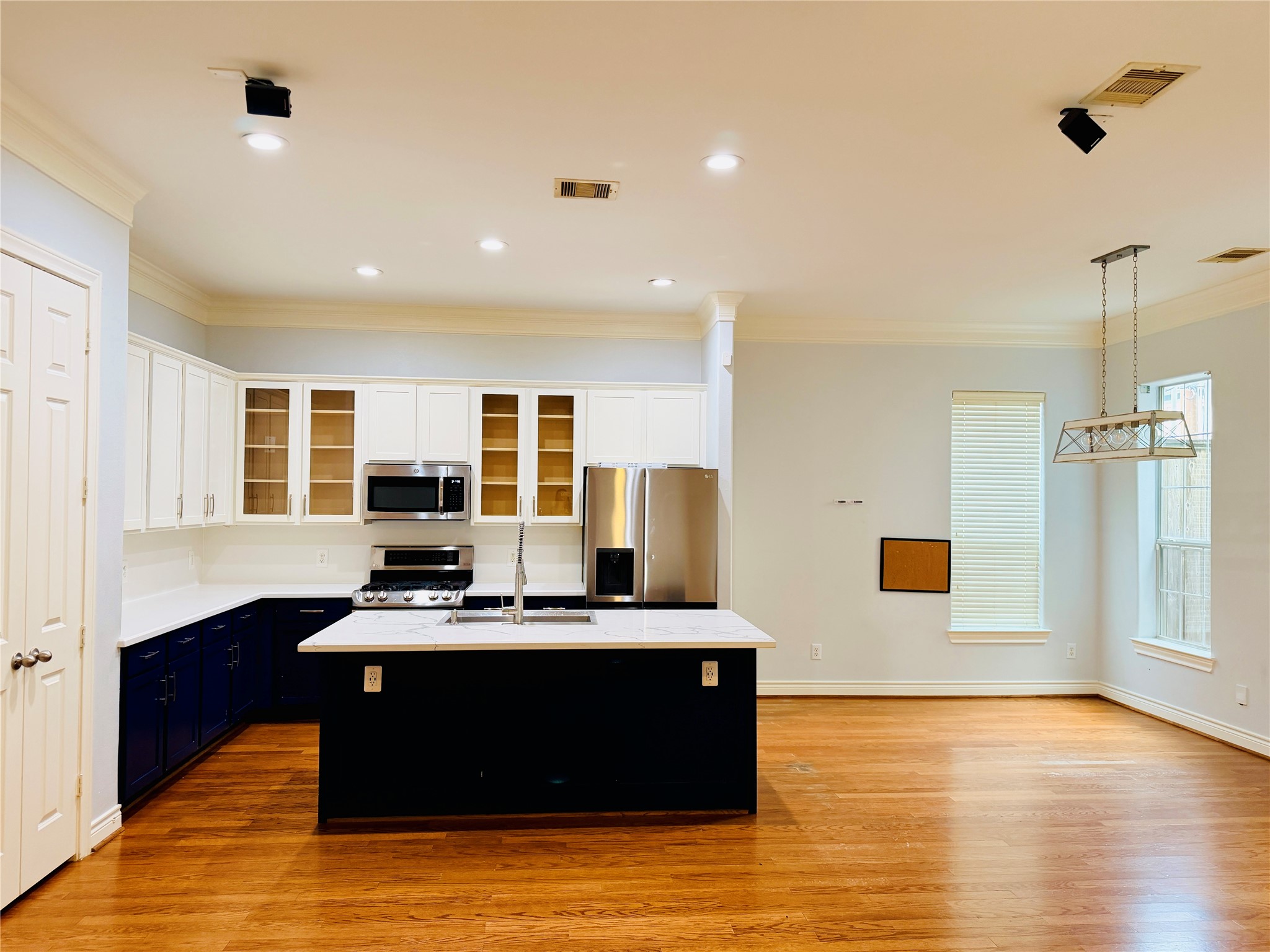 The kitchen features a spacious walk-in pantry with double doors.