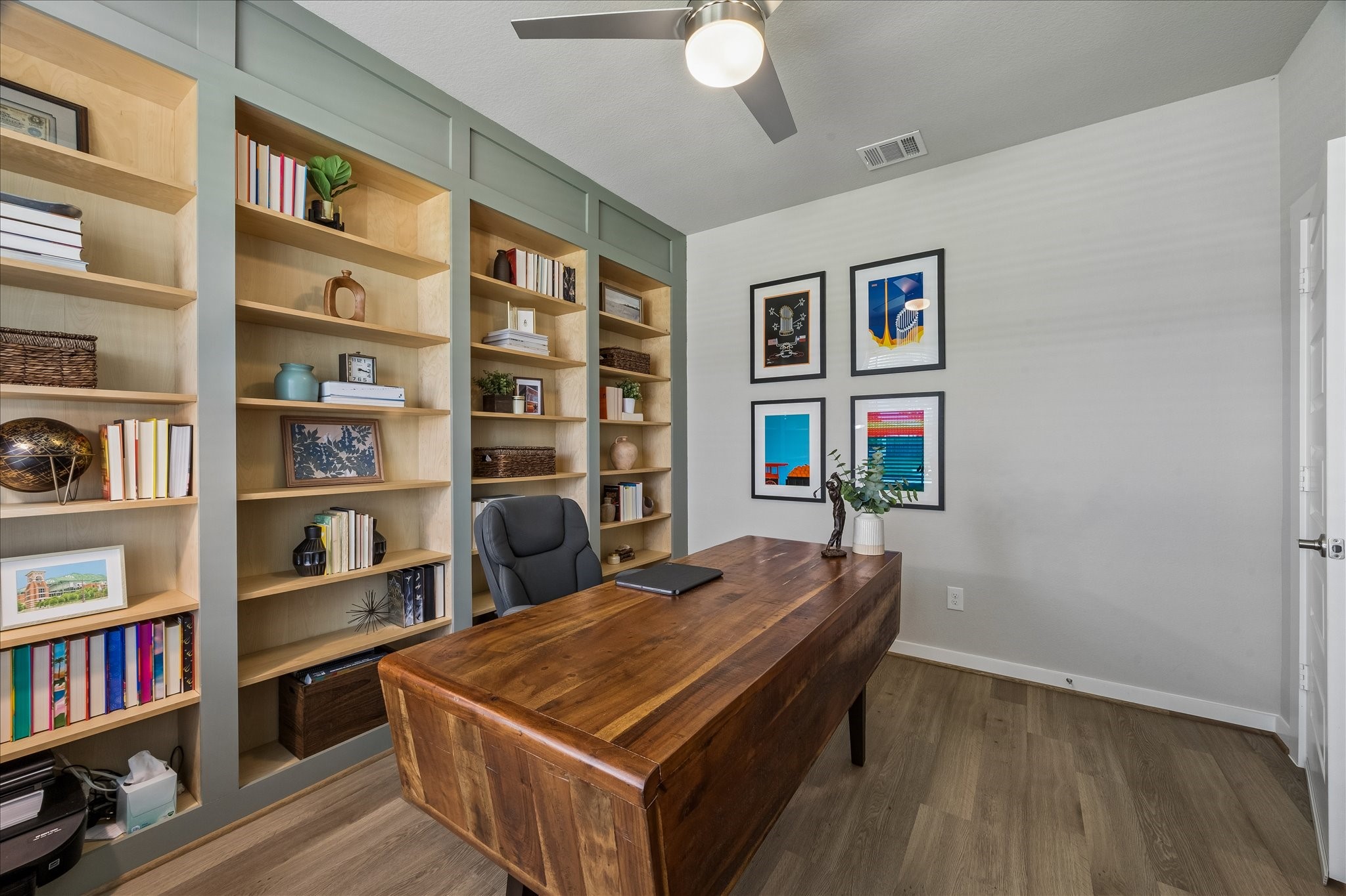 Study with upgraded custom wall to wall shelving.