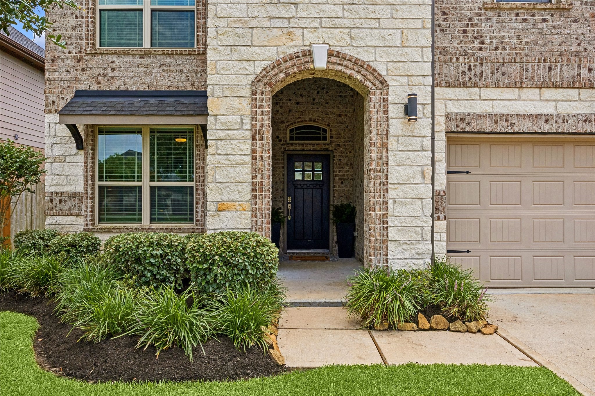 Beautiful front entrance with covered porch.
