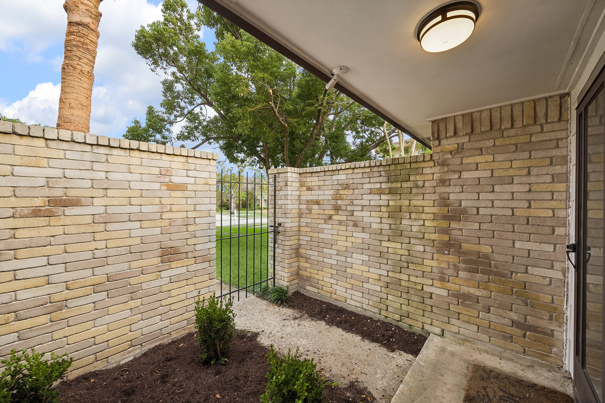 Small courtyard provides privacy and a pleasant welcome to guests. Small courtyard provides privacy and a pleasant welcome to guests.