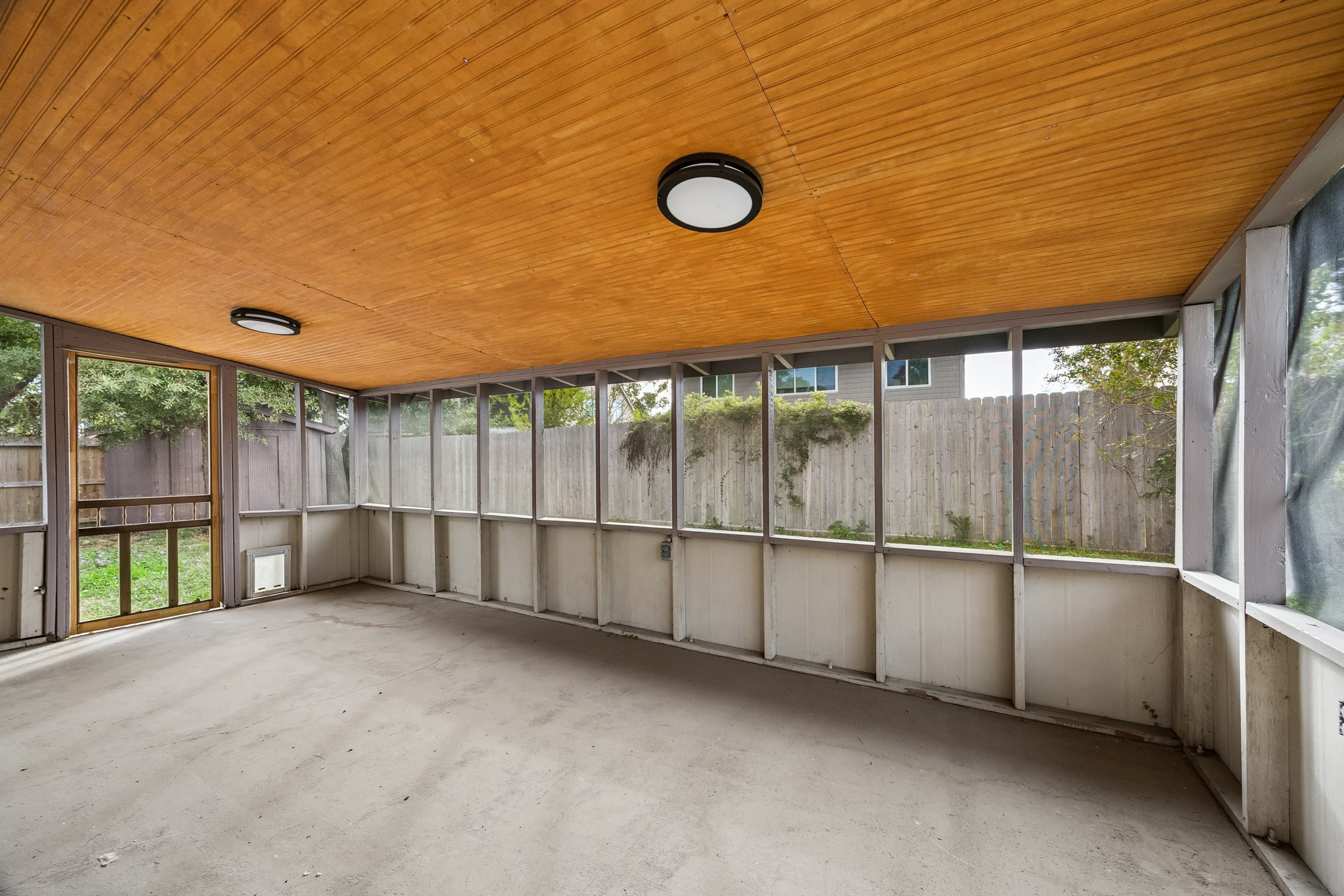 Great outdoor living space! Screened-in to keep the mosquitos away!