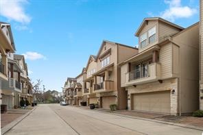 Welcome to the neighborhood with gated entry. View of double wide driveway in the community. No trouble backing out of the driveways here.