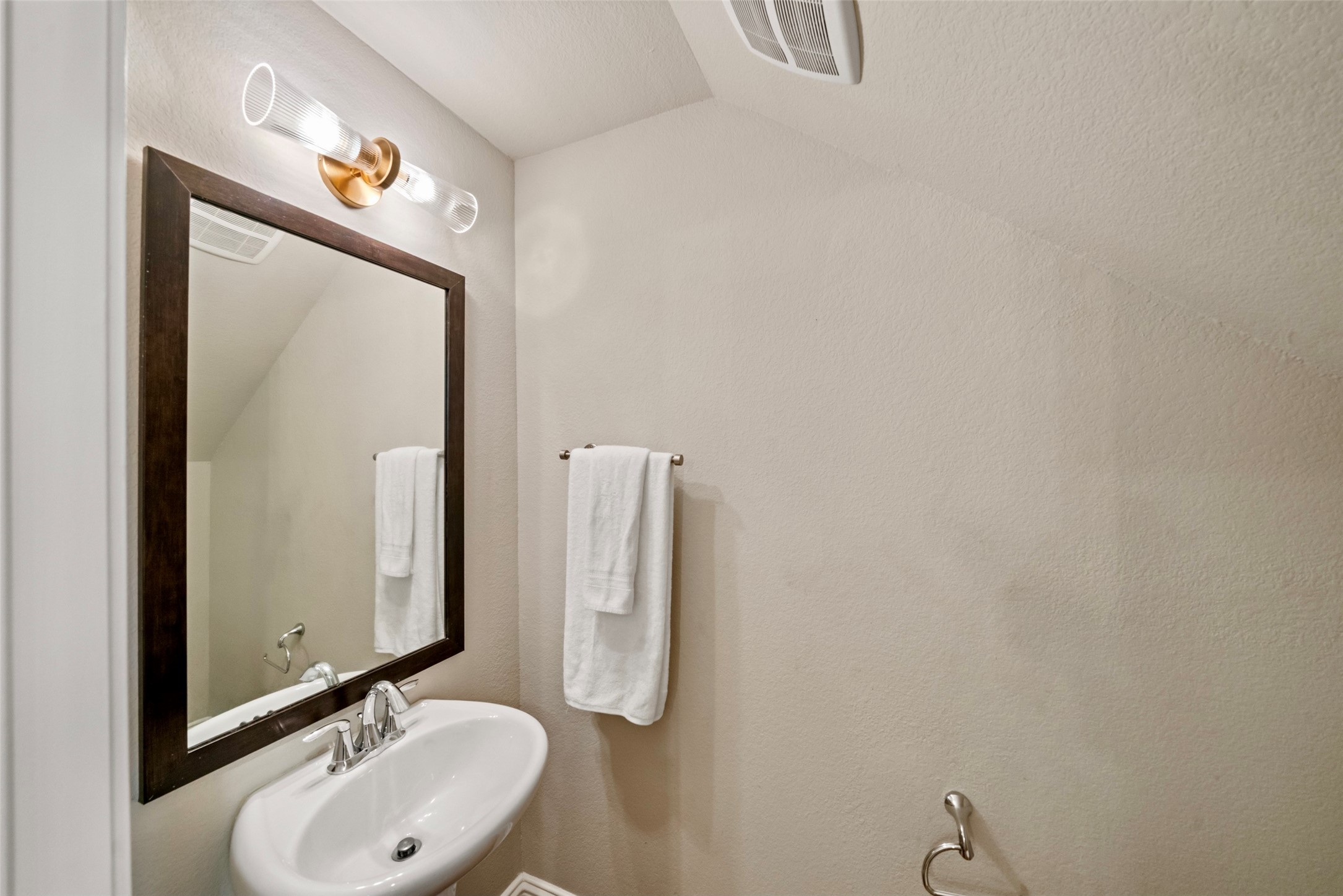 The half bath is conveniently located just off the kitchen.