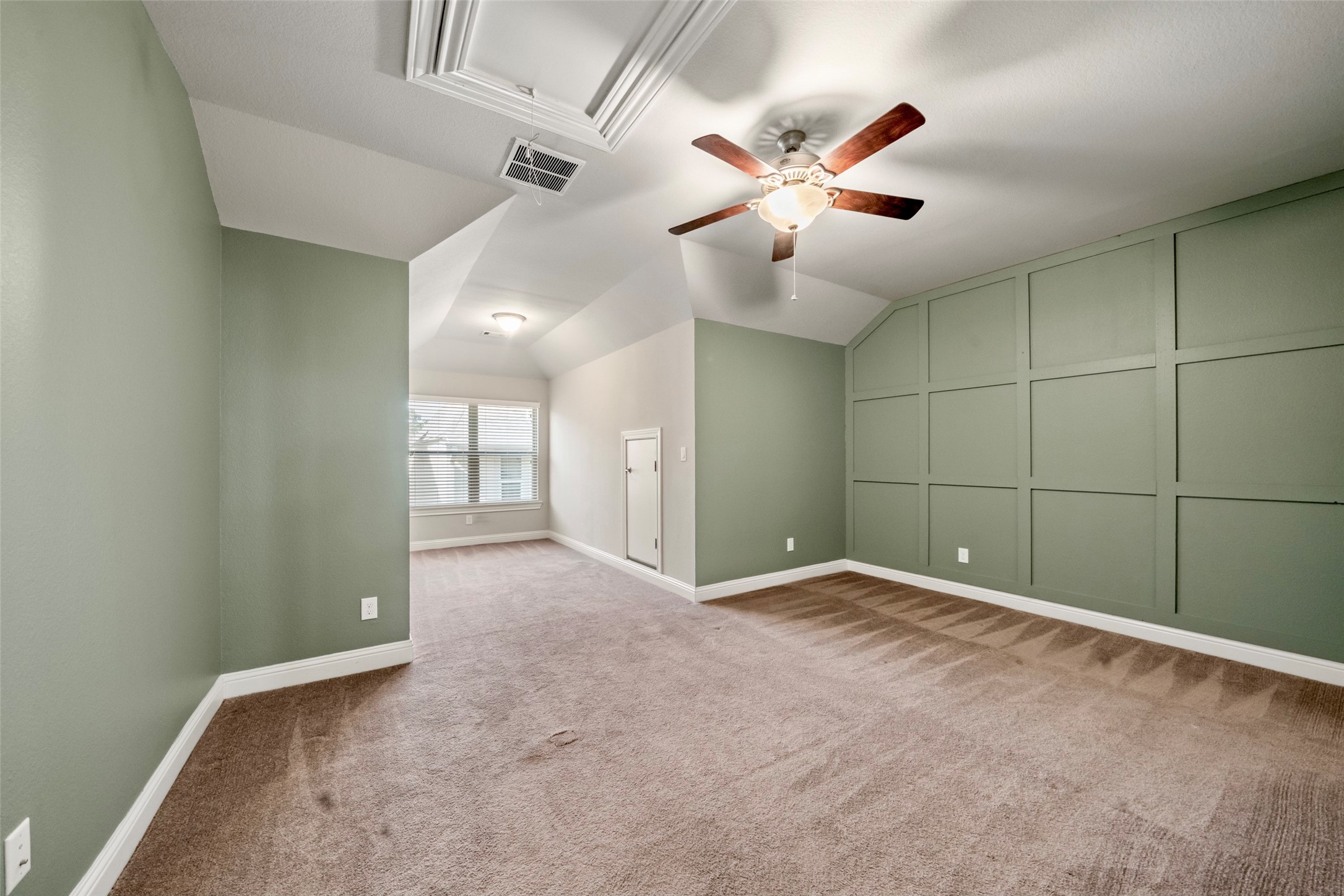 Bedroom 2 with custom molding and extra space for desk, play space, reading nook, etc. Bedroom 2 & 3 have an identical layout.