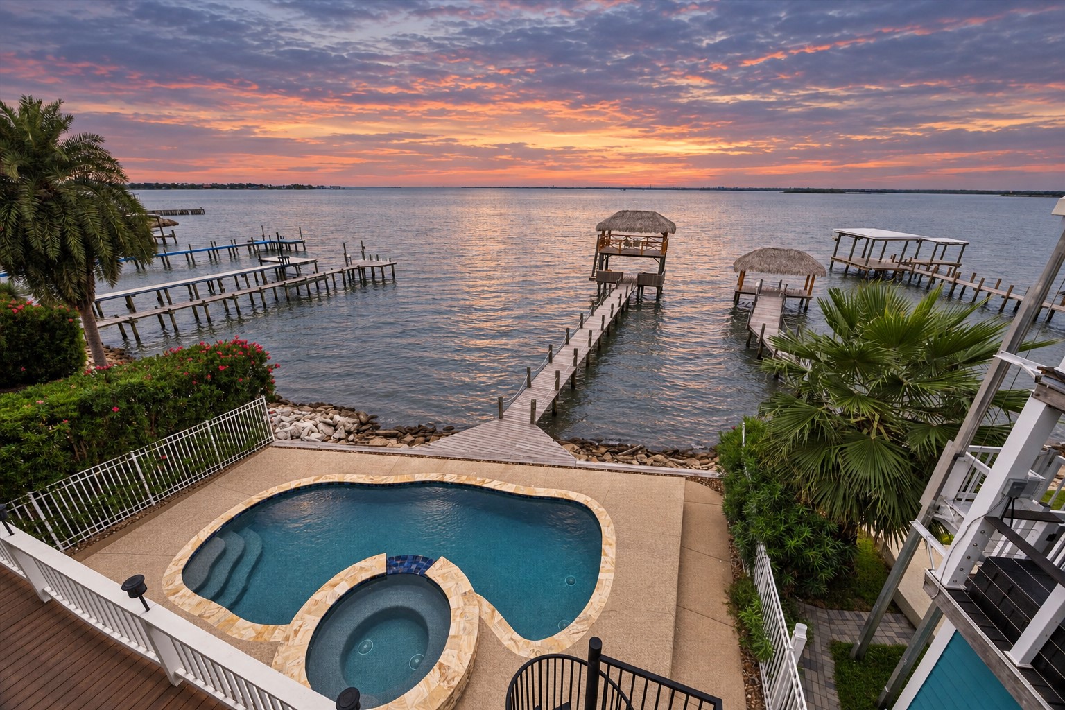 THIS WATERFRONT EDWARDS LANDING HOME OFFERS EXPANSIVE OPEN-WATER VIEWS WITH A PRIVATE PIER EXTENDING FROM THE PROPERTY.