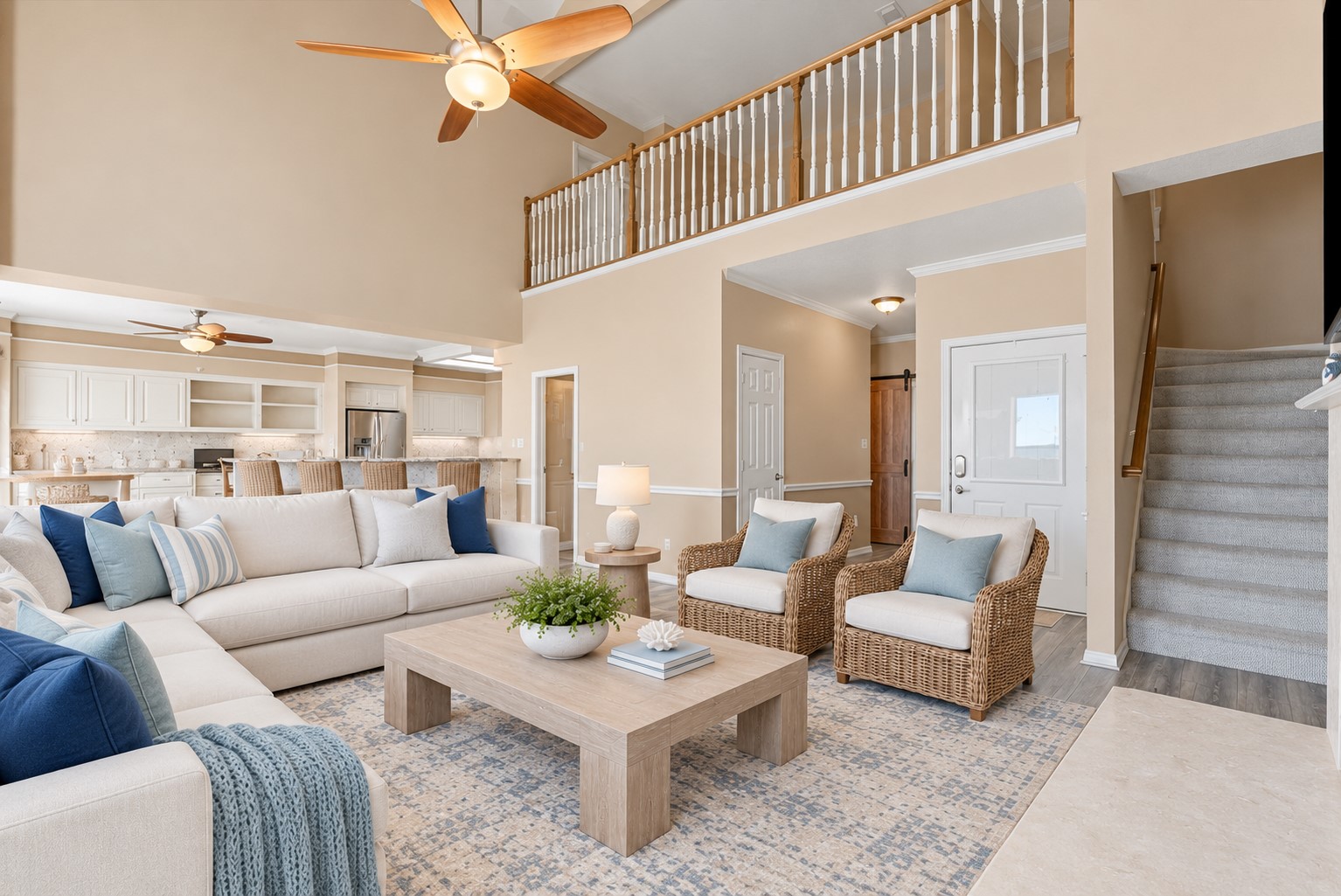 SOARING CEILINGS AND AN OPEN SECOND-FLOOR LANDING ADD VOLUME TO THE FAMILY ROOM, WHICH FLOWS DIRECTLY INTO THE KITCHEN. **Virtually Staged