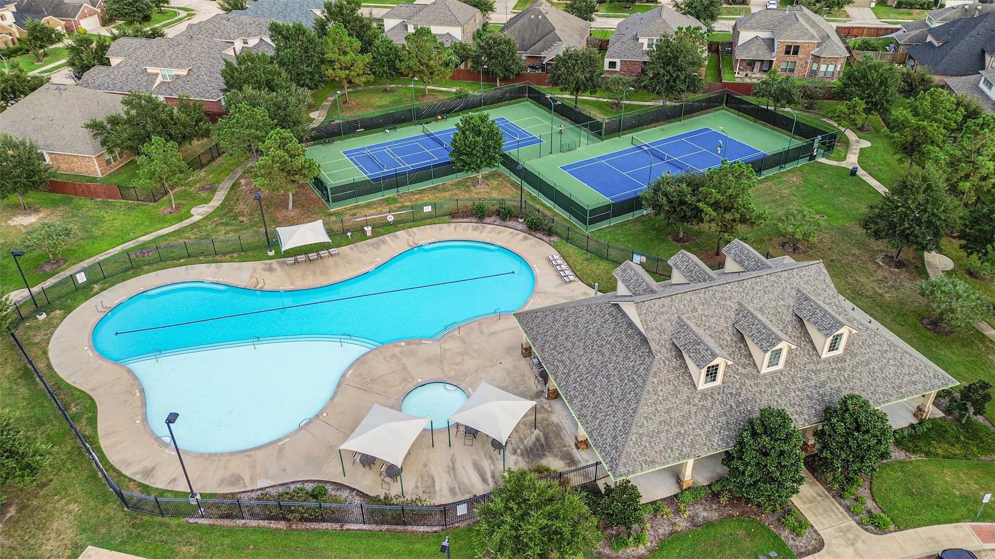 Cinco Ranch offers community pools, tennis courts and many more amenitites.