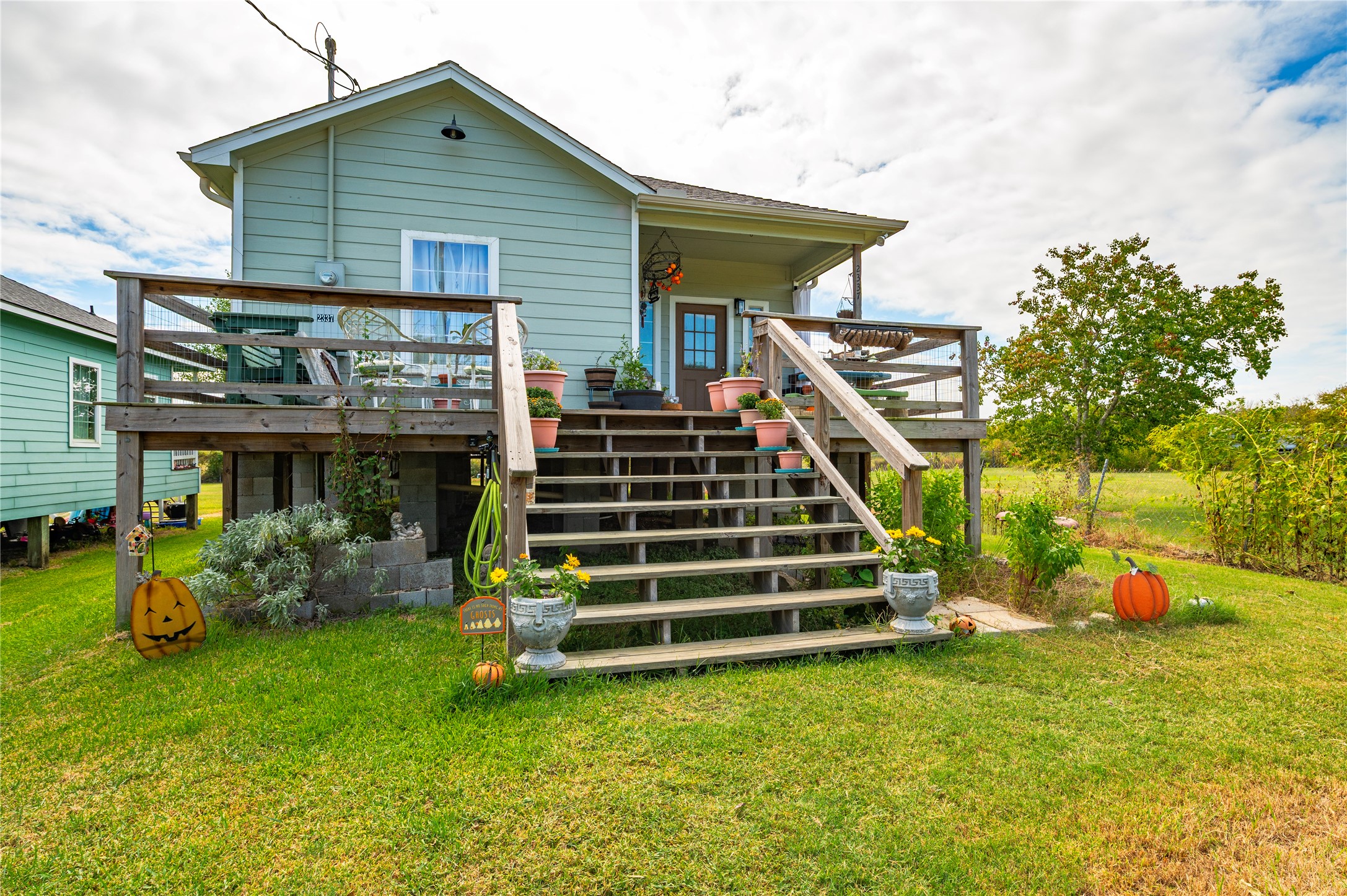 Large wooden staircase and front deck. Large wooden staircase and front deck.