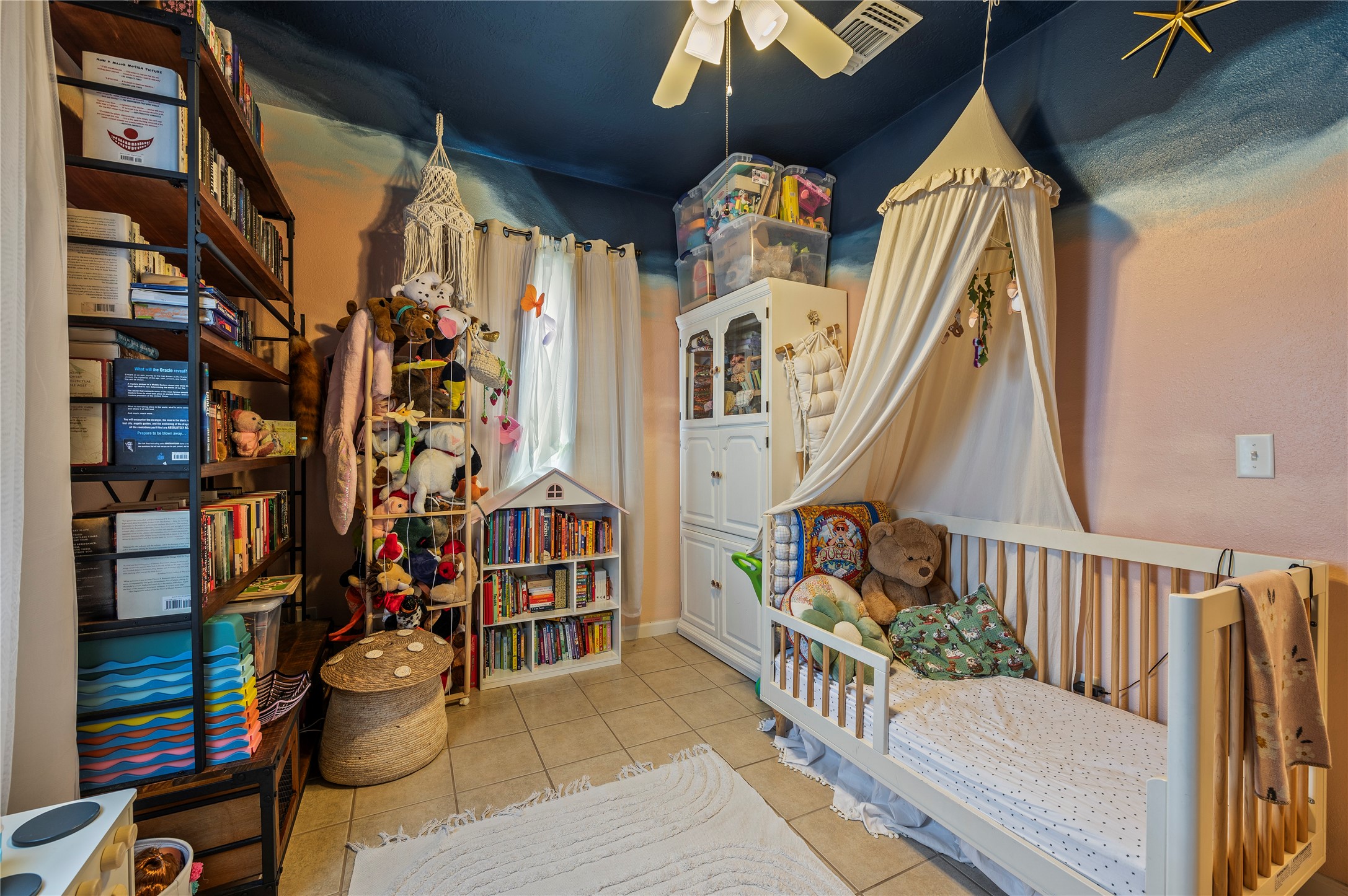 2nd bedroom is spacious with custom paint.