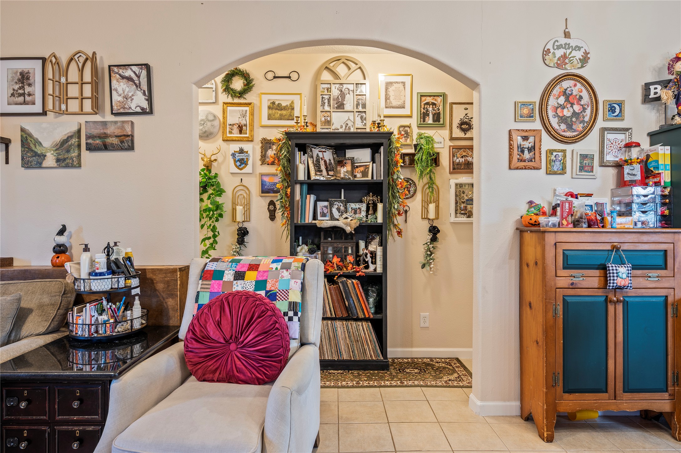 Archway architecture accents the hallway to the bedrooms and baths.