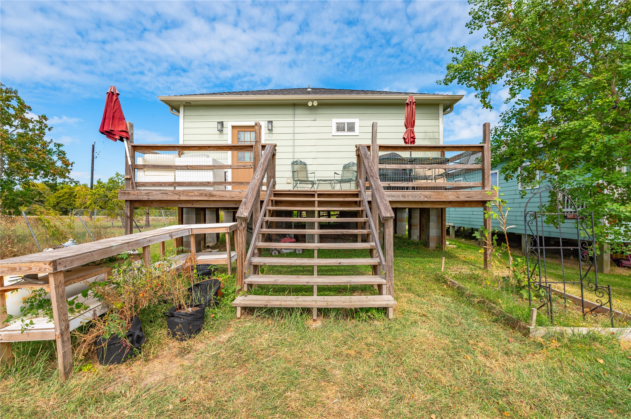 Another view of the wooden staircase and back deck.