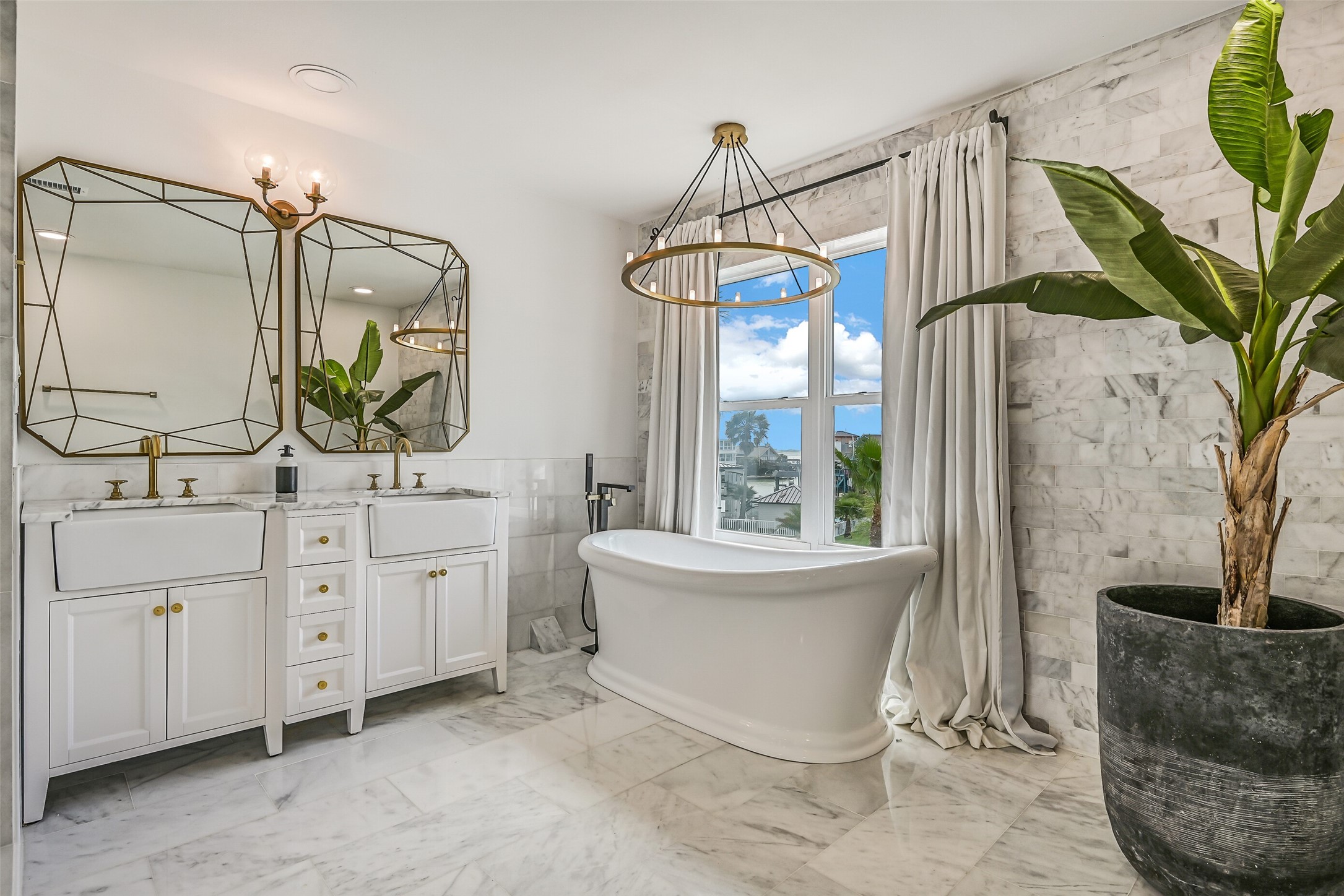Slow down with a long soak in the freestanding tub. This private bath gives the primary suite another place to relax when the day winds down.