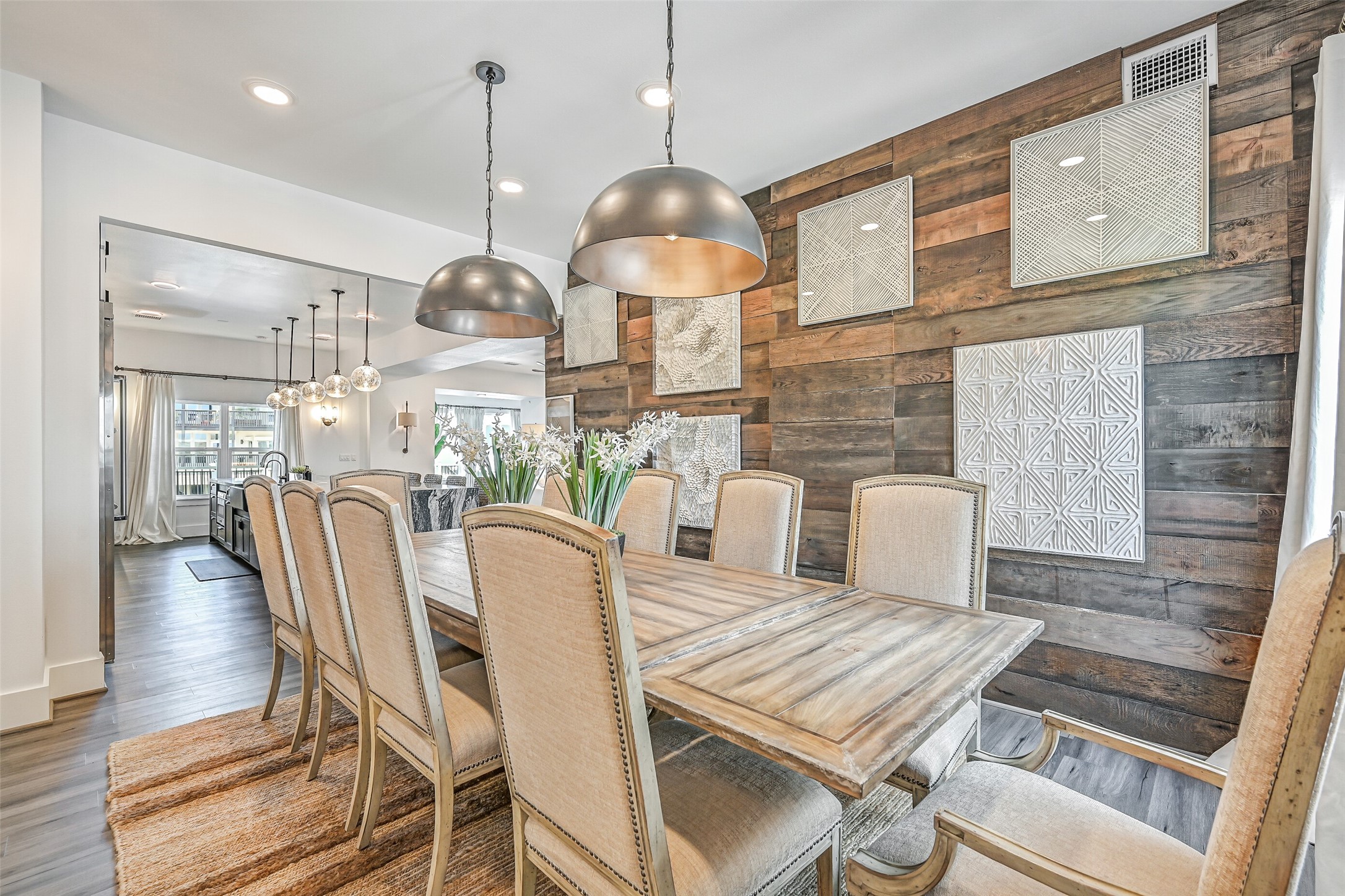 Bring everyone to the table and let dinner linger. Positioned near the kitchen and living spaces, the dining area keeps meals connected to everything happening around the home.
