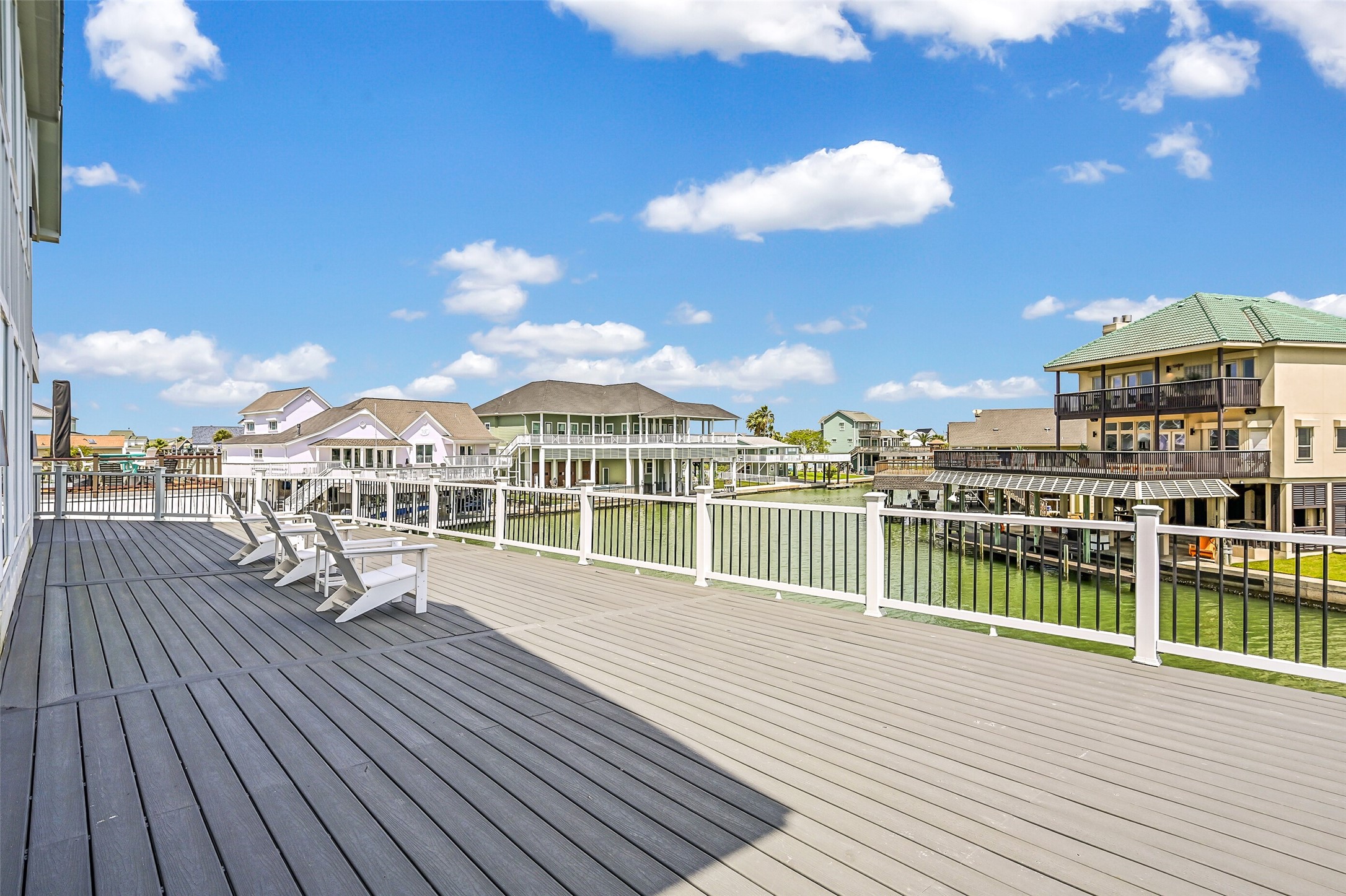 Morning coffee may become your favorite part of the day here. The private deck overlooks the canal and creates a peaceful outdoor extension of the primary suite.
