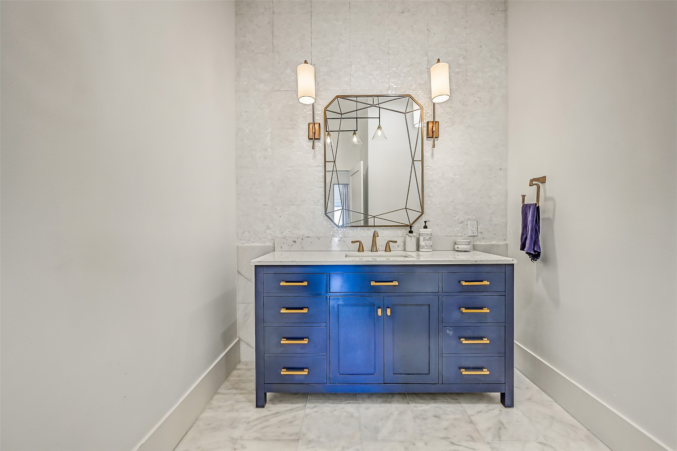 A stylish powder room is conveniently positioned for guests near the main entertaining spaces. Private bedroom areas can remain just that, private.