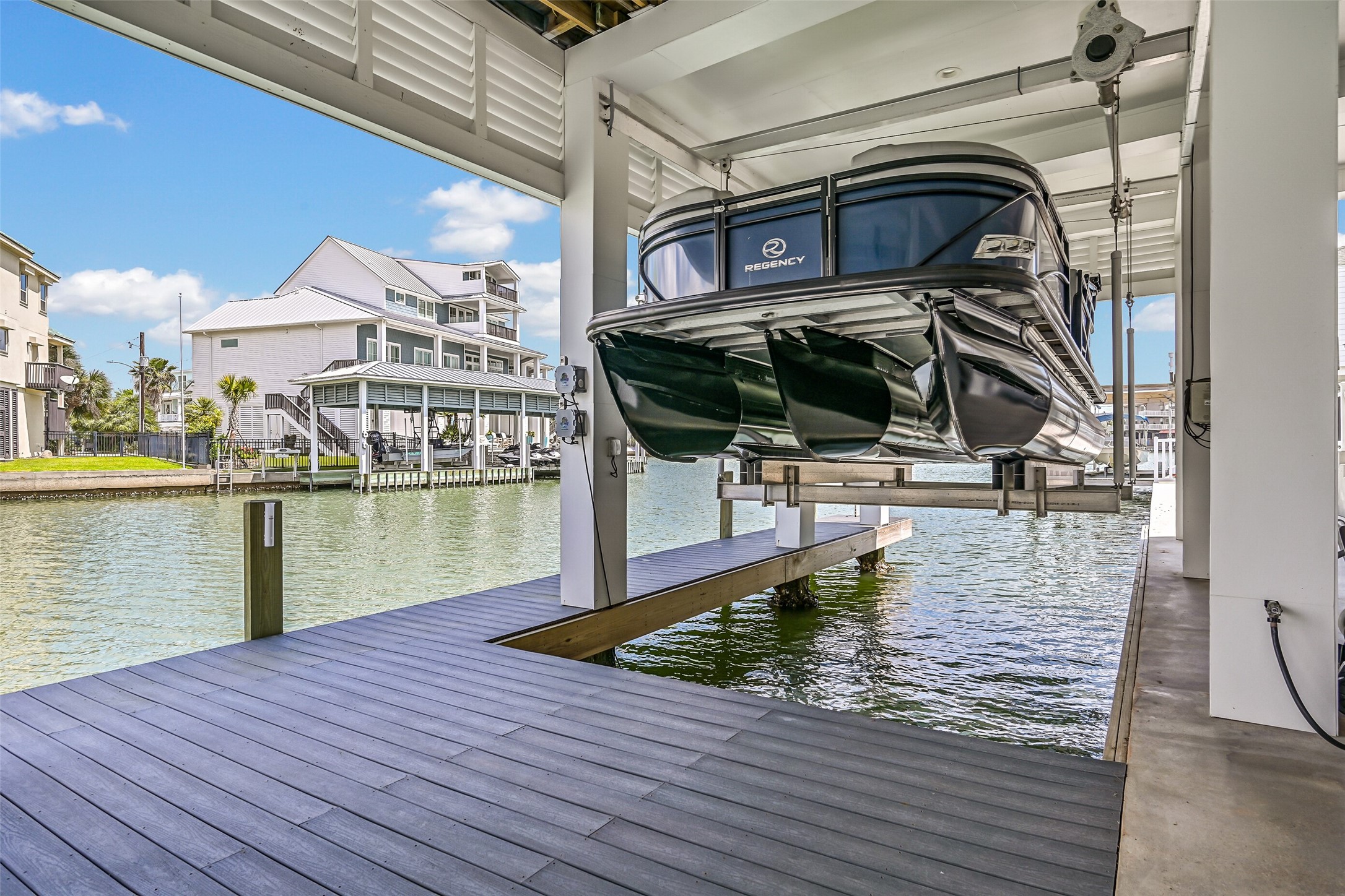 Your next day on the water can begin at home. The boathouse, lifts and deep-water canal access make spontaneous boating part of the appeal of owning on Tiki.