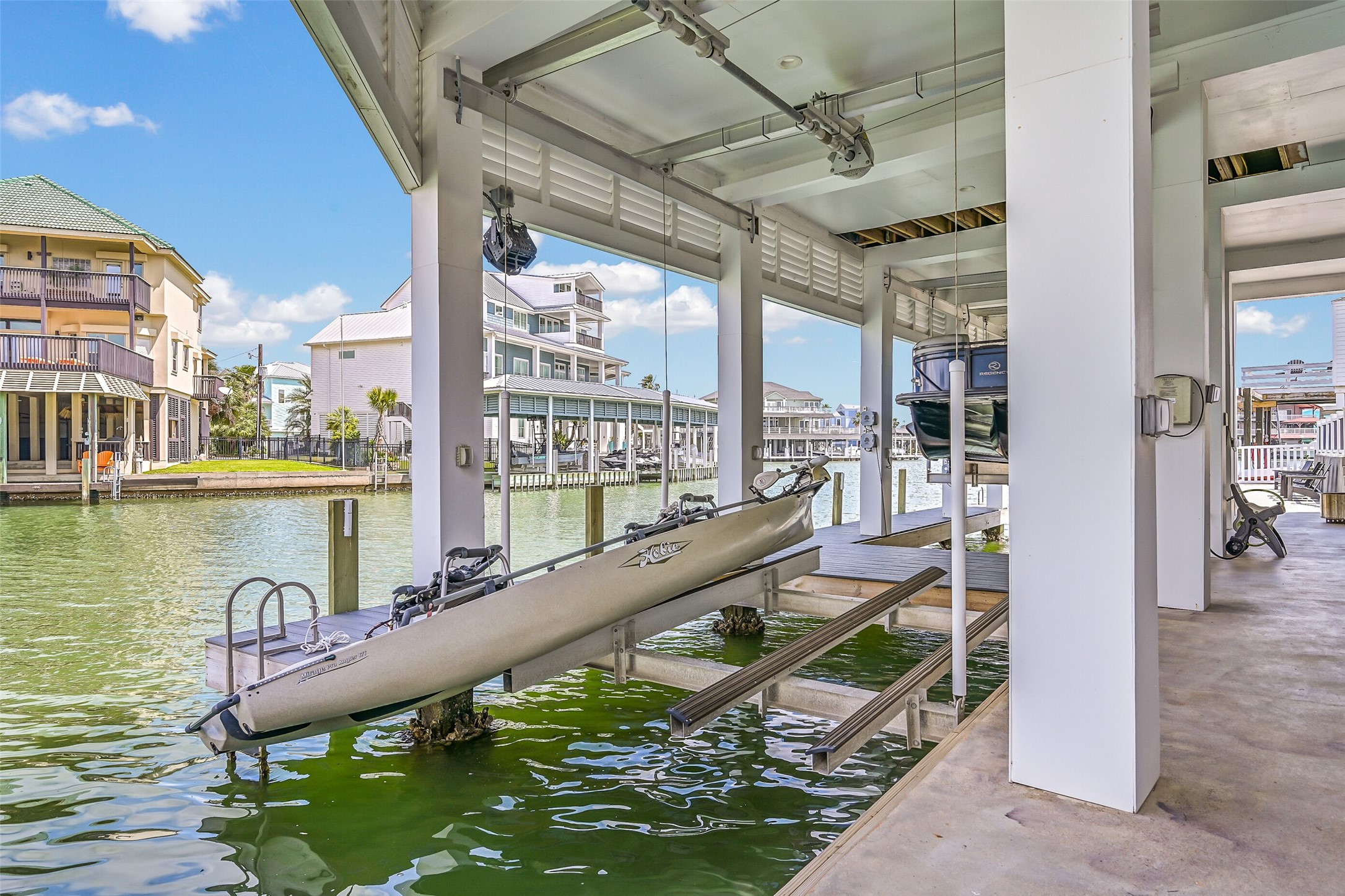 The best Tiki mornings can start right here. Walk downstairs, step onto the dock and head out on the water with covered lift access just beyond your door.