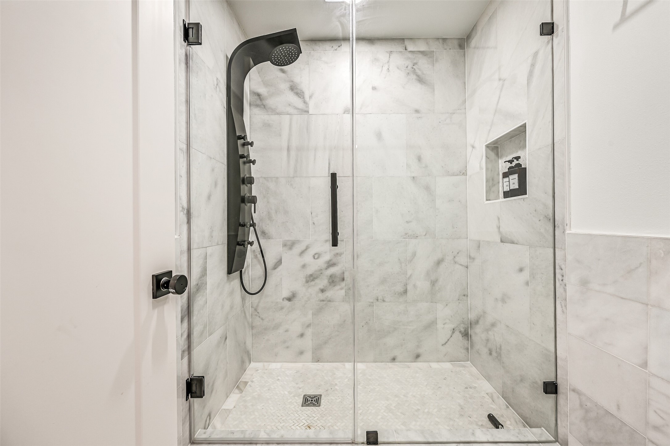 A spacious walk-in shower and private bath make extended visits feel effortless. It is another thoughtful feature for a home built to welcome a crowd.