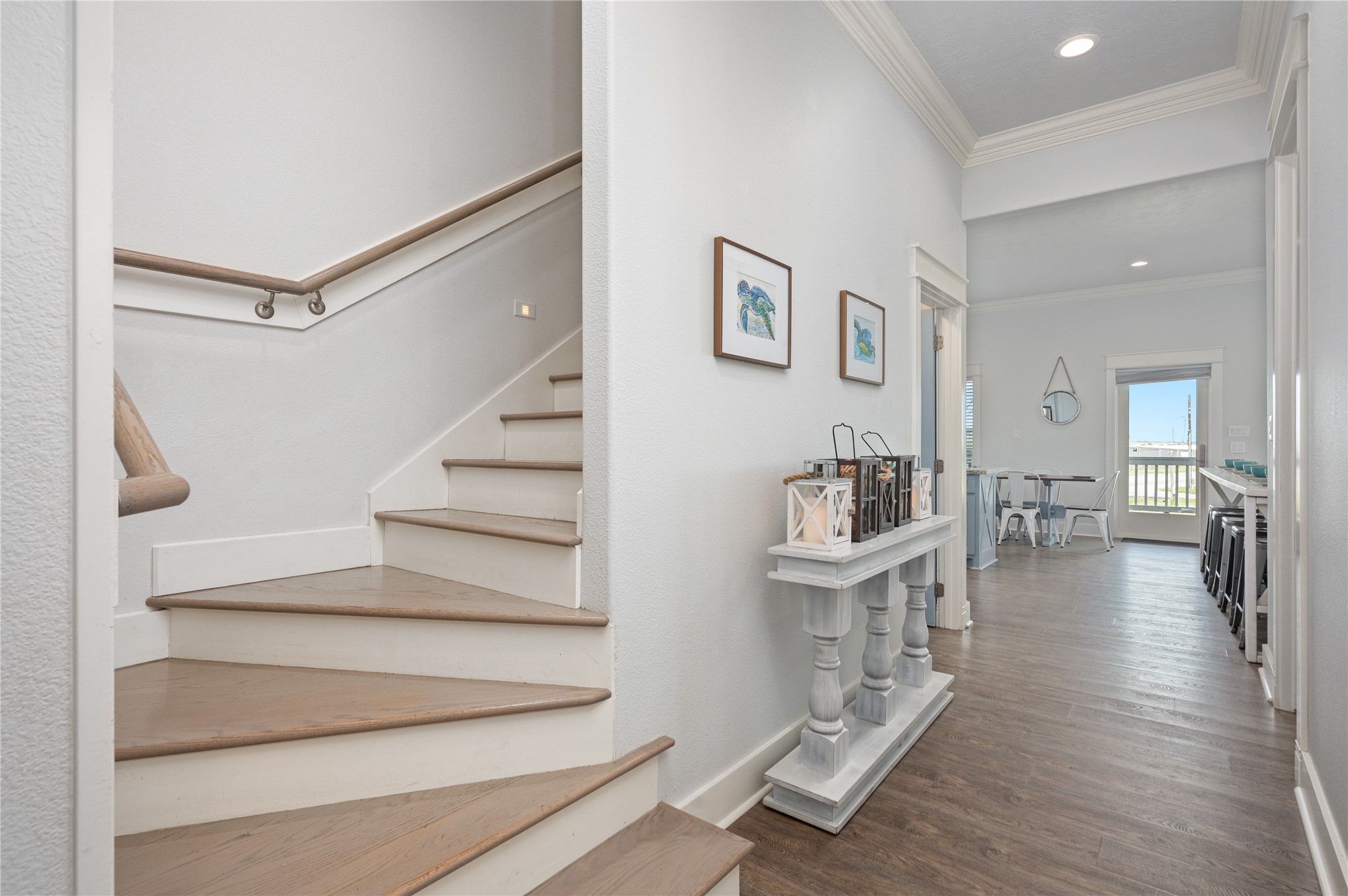 Moving through the home feels open and connected, with the staircase leading naturally into the main living spaces.