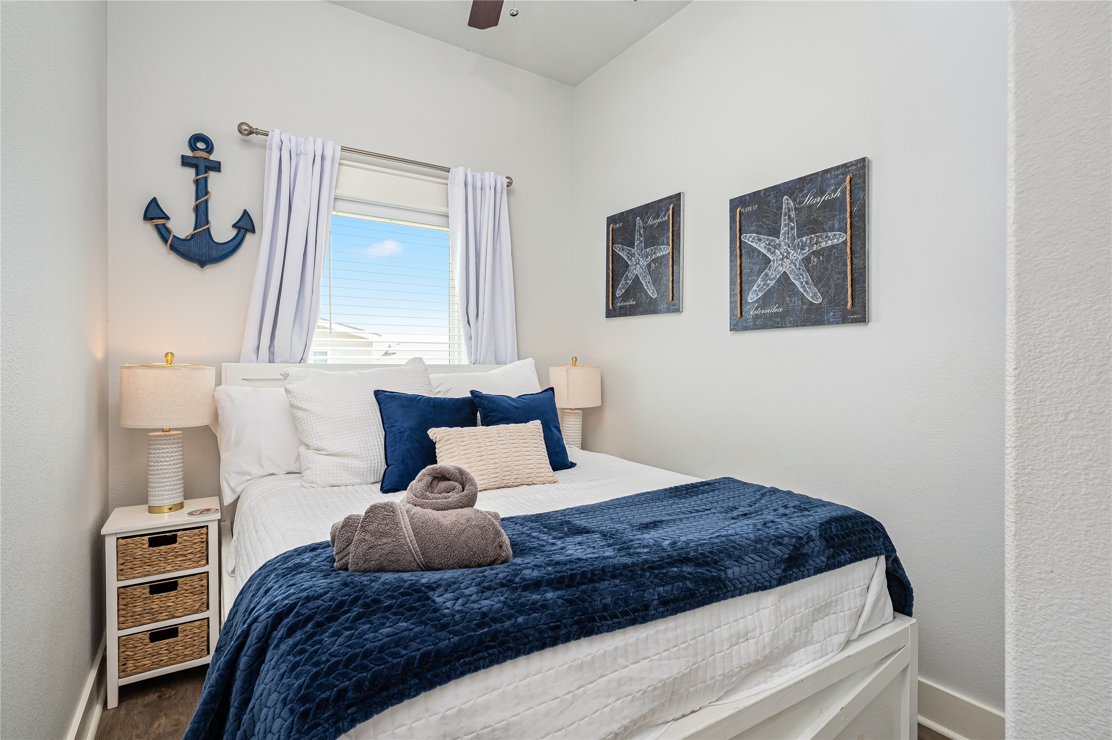 A cozy bedroom gives you a peaceful place to recharge, with natural light and a relaxed coastal feel.