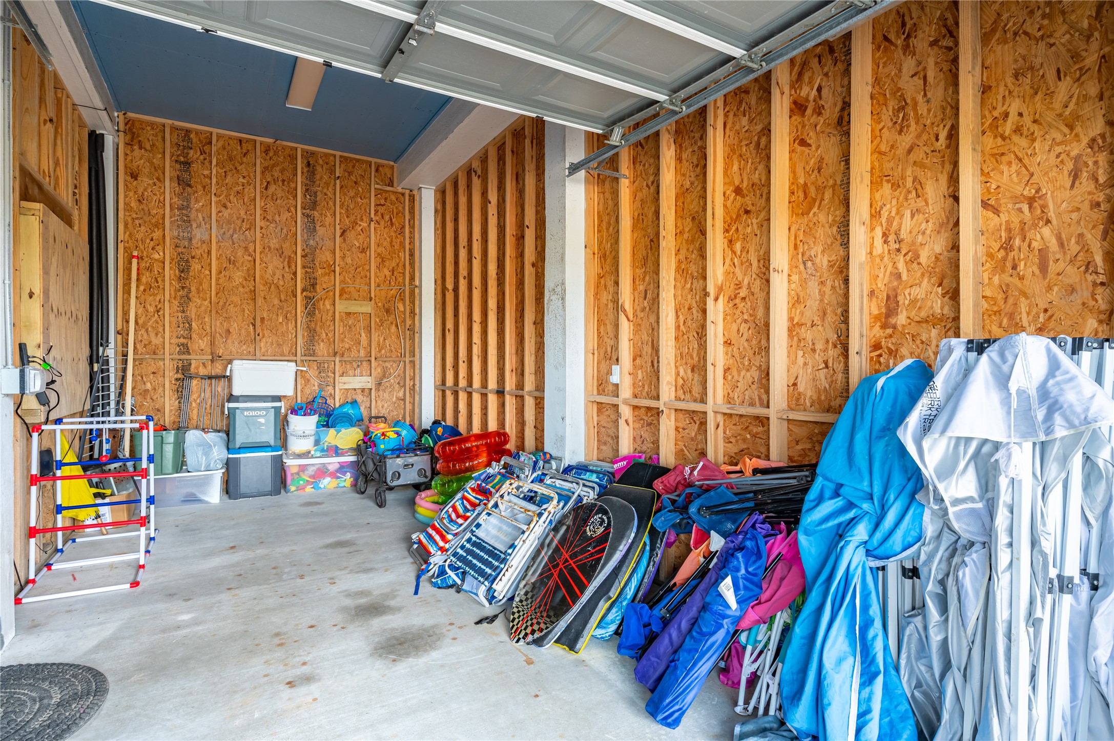 Beach gear, games, and seasonal essentials stay out of the way in your oversized ground-level storage space.