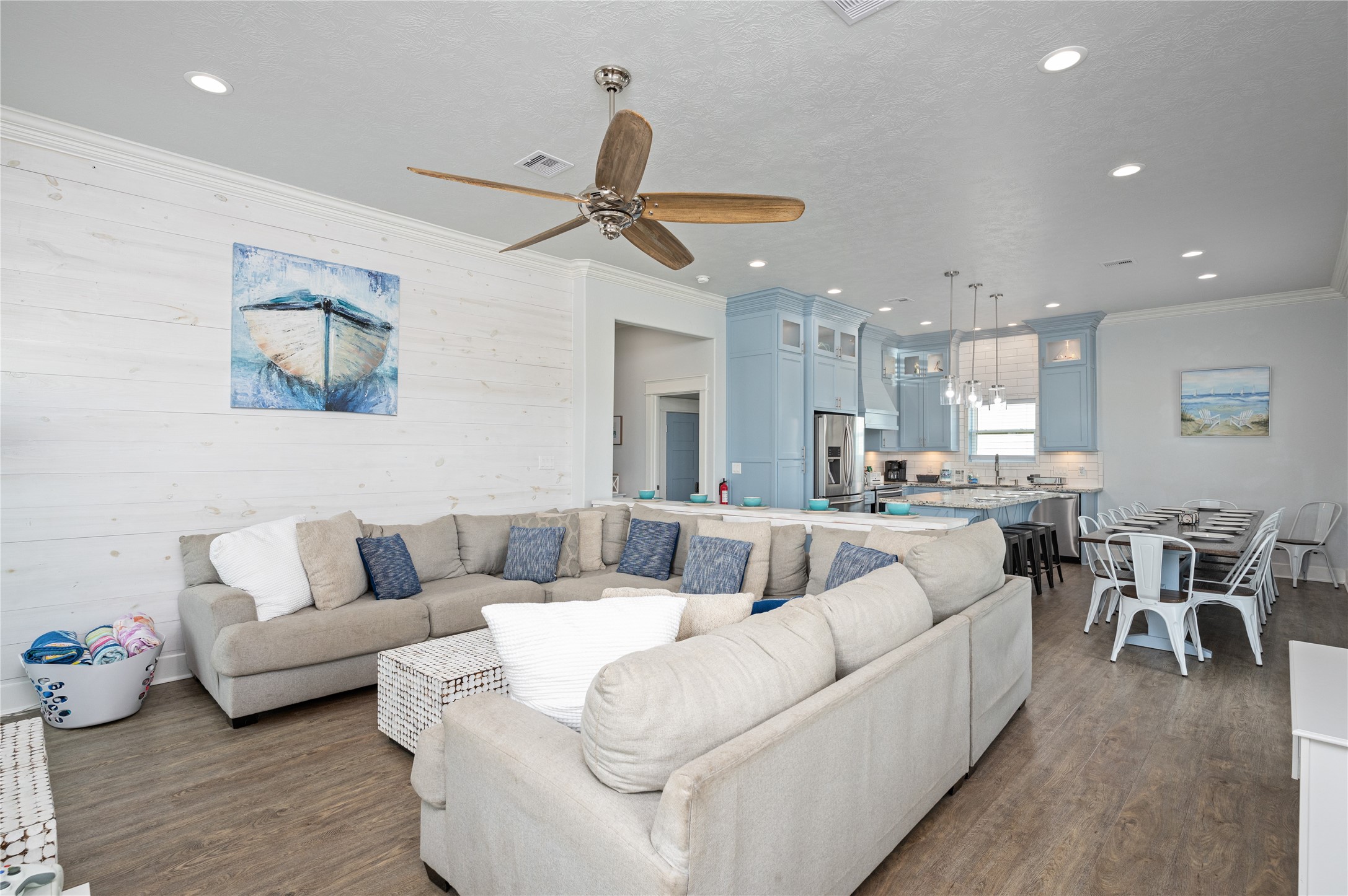 Everyone has room to come together in your bright, open living space, where the kitchen, dining area, and oversized sectional keep the whole crew connected.