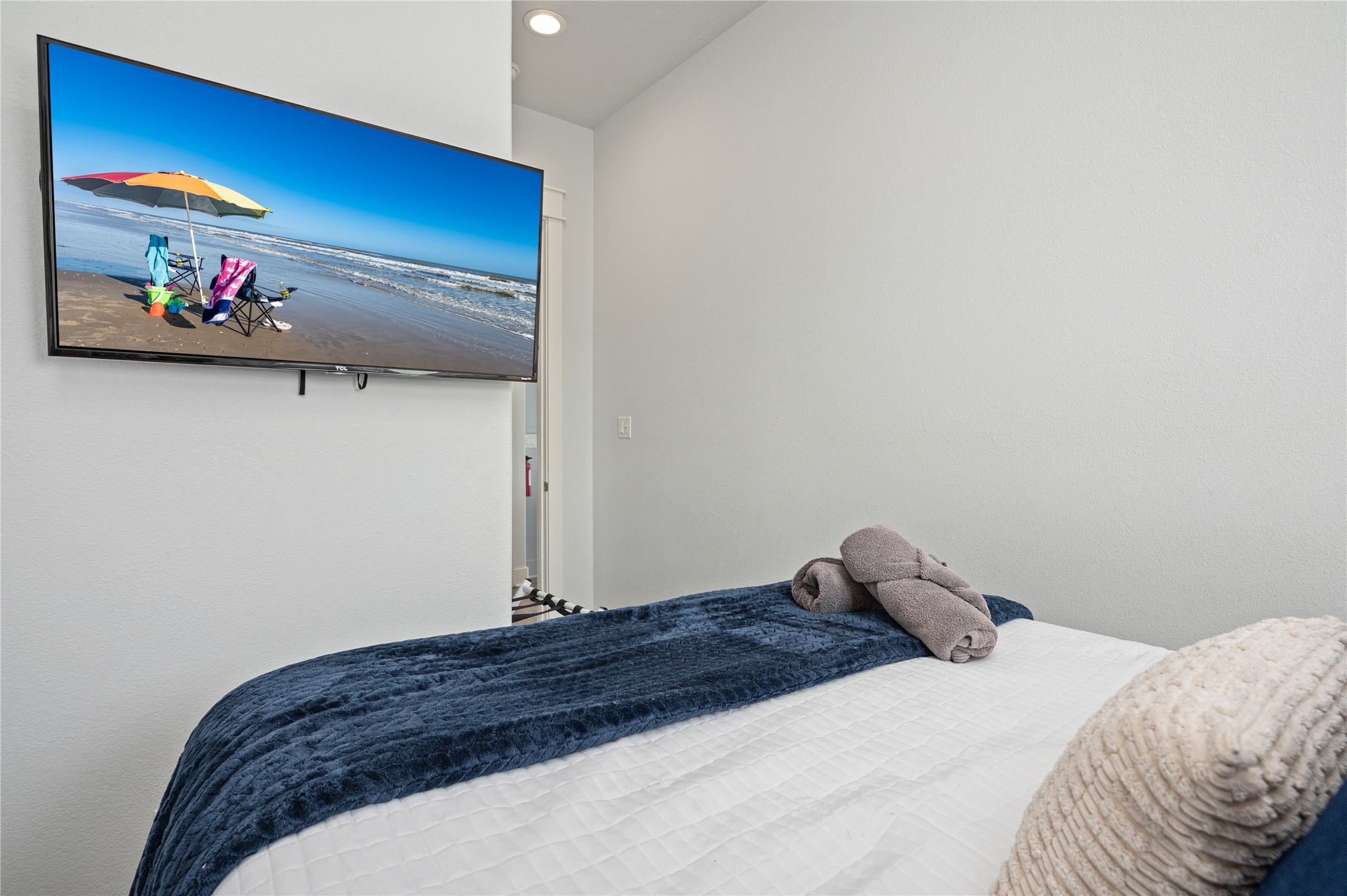 Kick back in bed and enjoy your favorite shows on the wall-mounted TV.