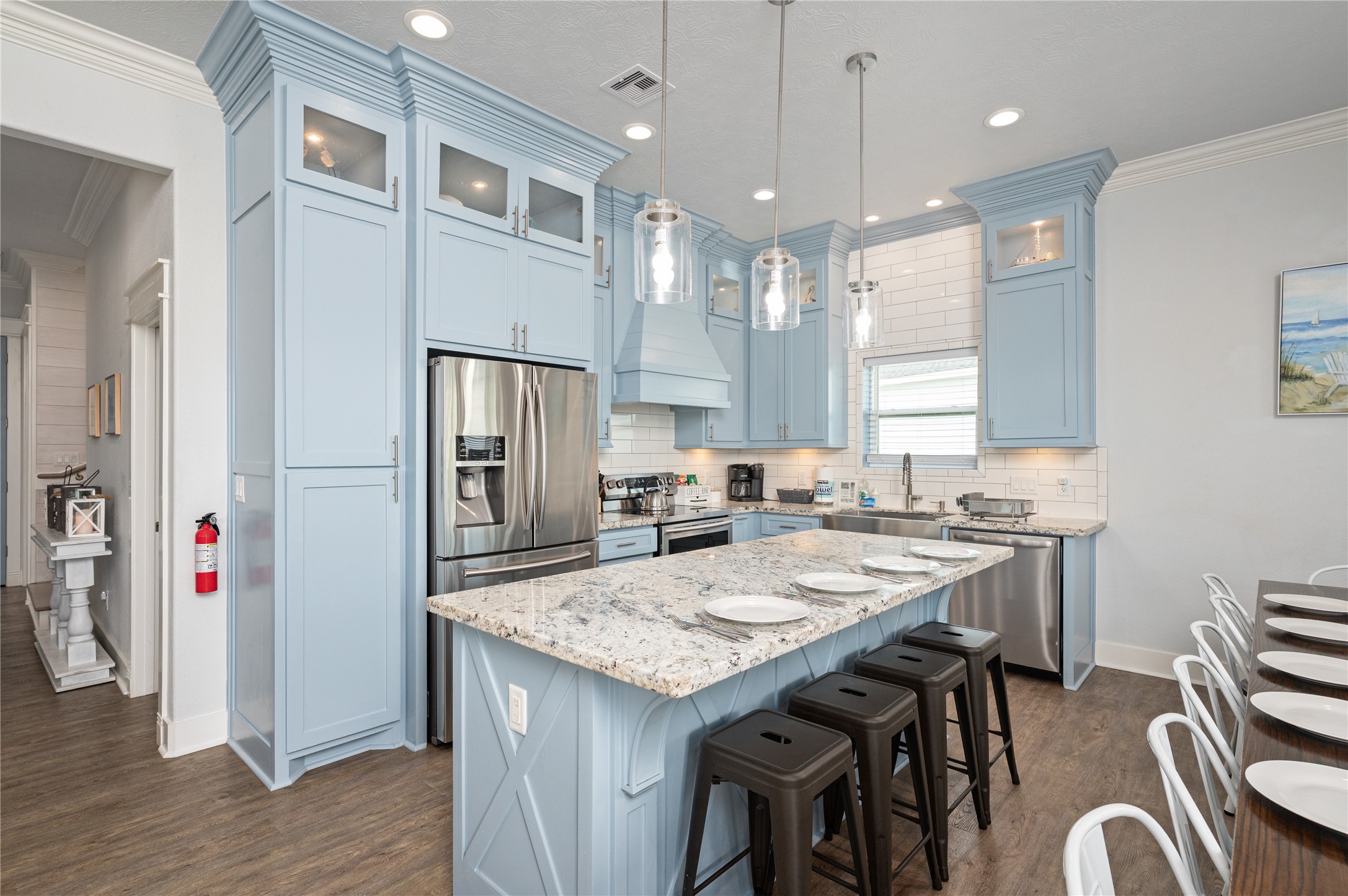 Cooking feels effortless in your beautifully appointed kitchen, where abundant cabinetry, granite counters, stainless appliances, and a generous island give you room to spread out.